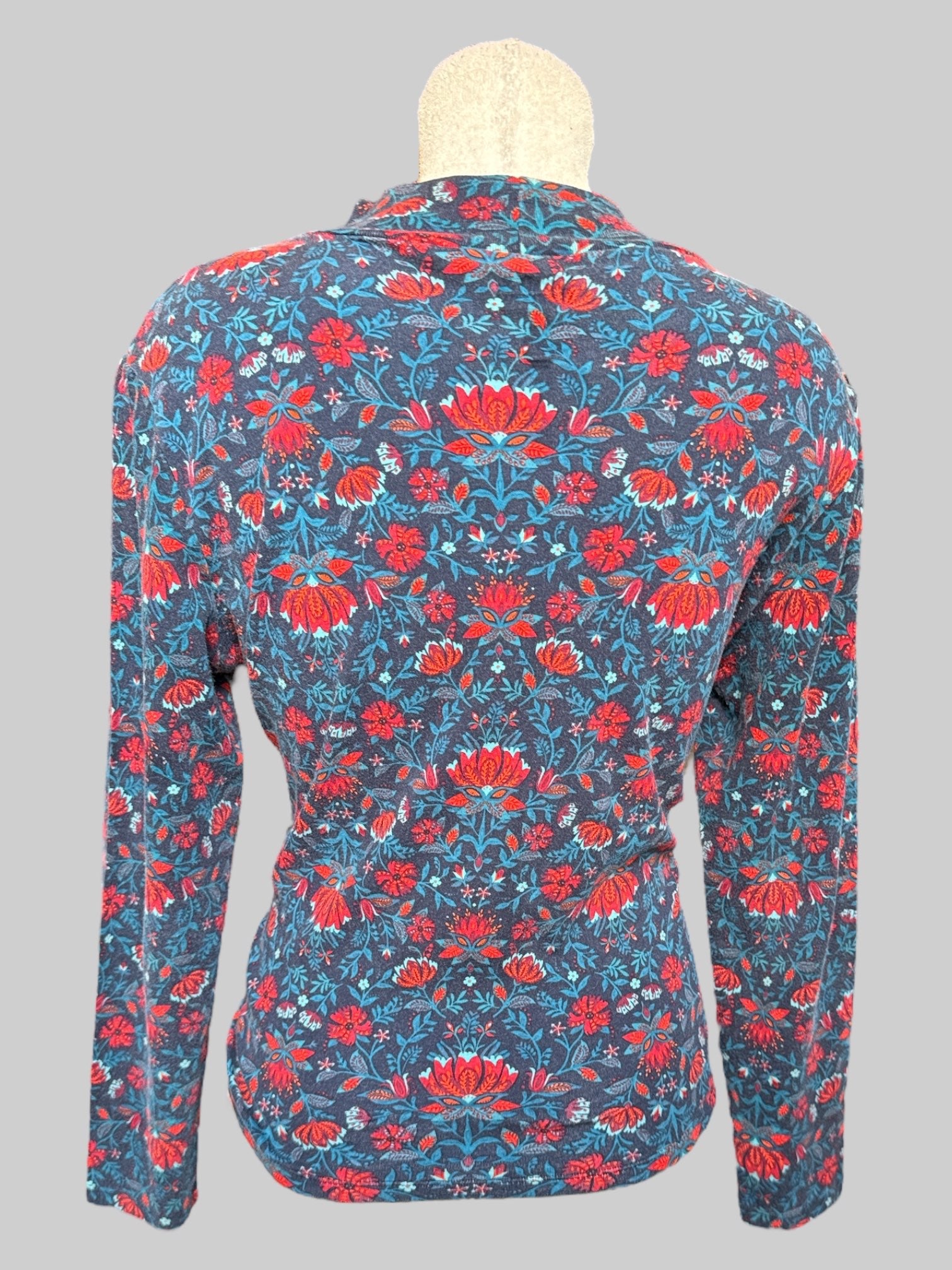 0X Blue turtleneck with blue red and orange florals