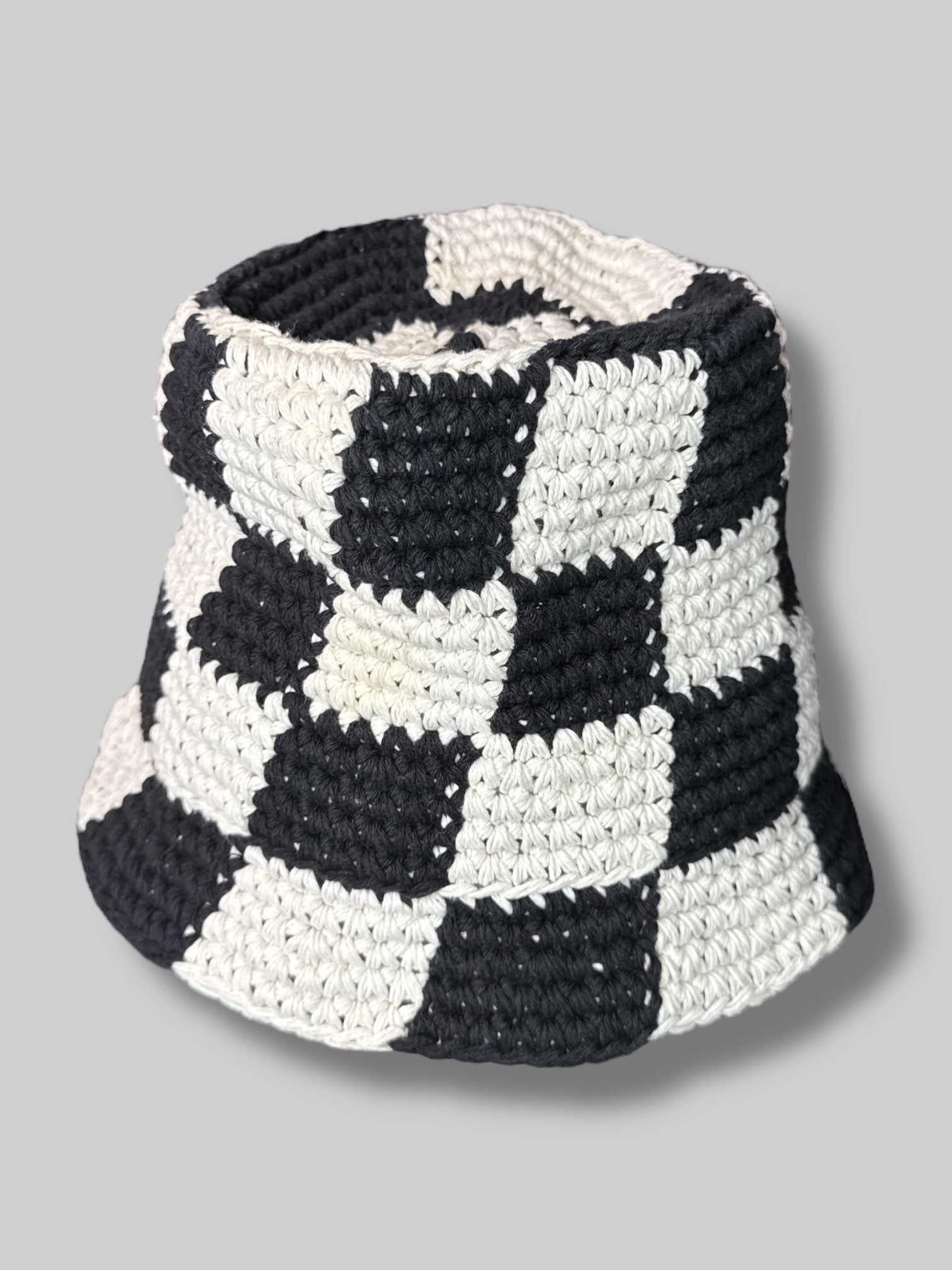 Black and white checkered crocheted bucket hat