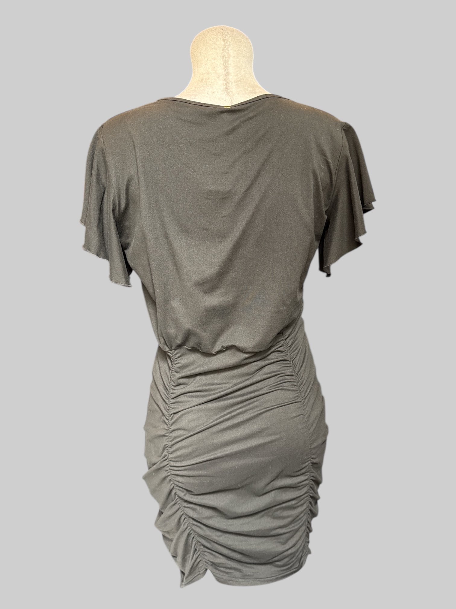 L Black body con dress with lots of ruching on bottom
