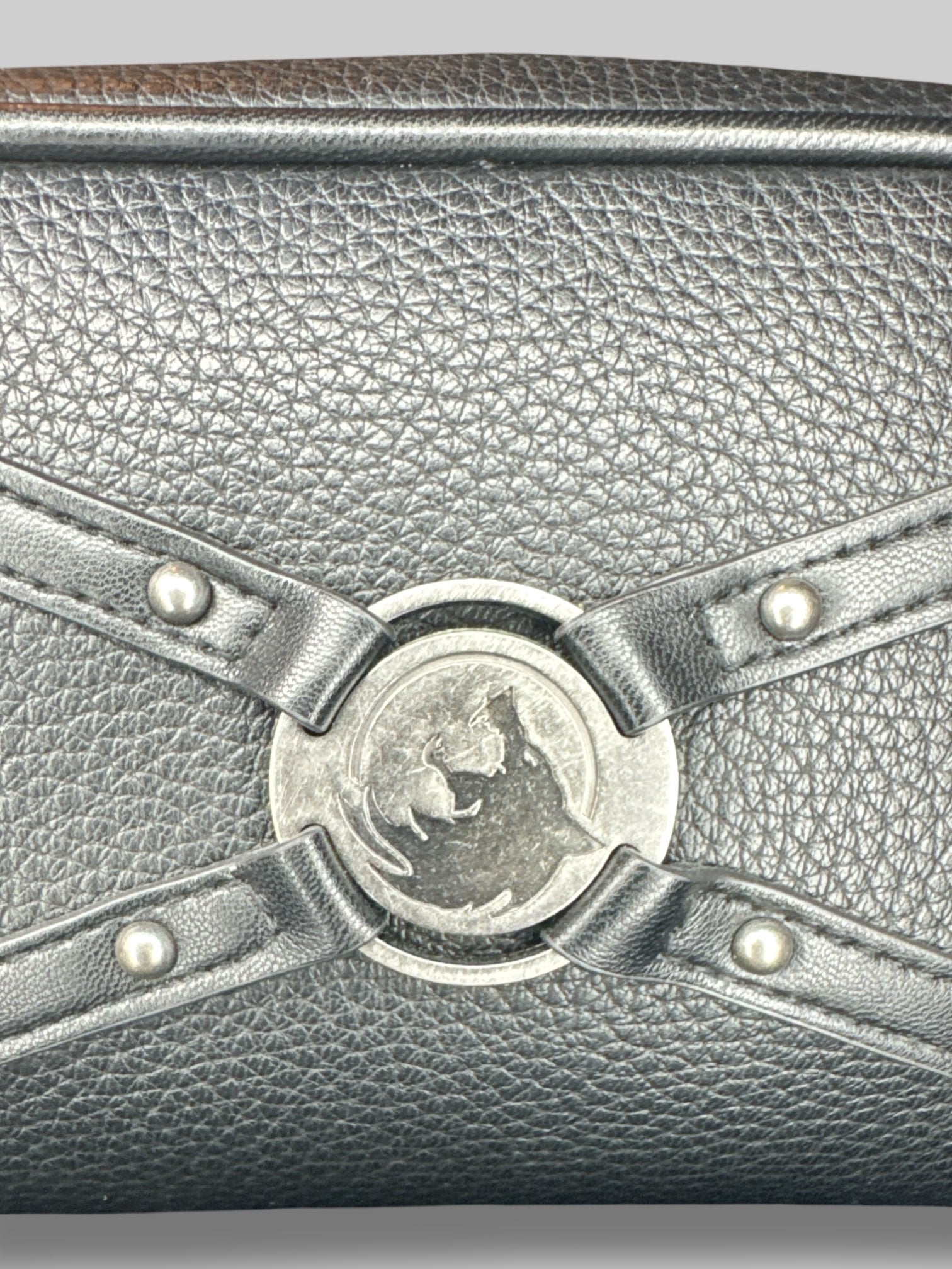 NWT black “The Witcher “bag with emblem on front, and decorative zipper chain