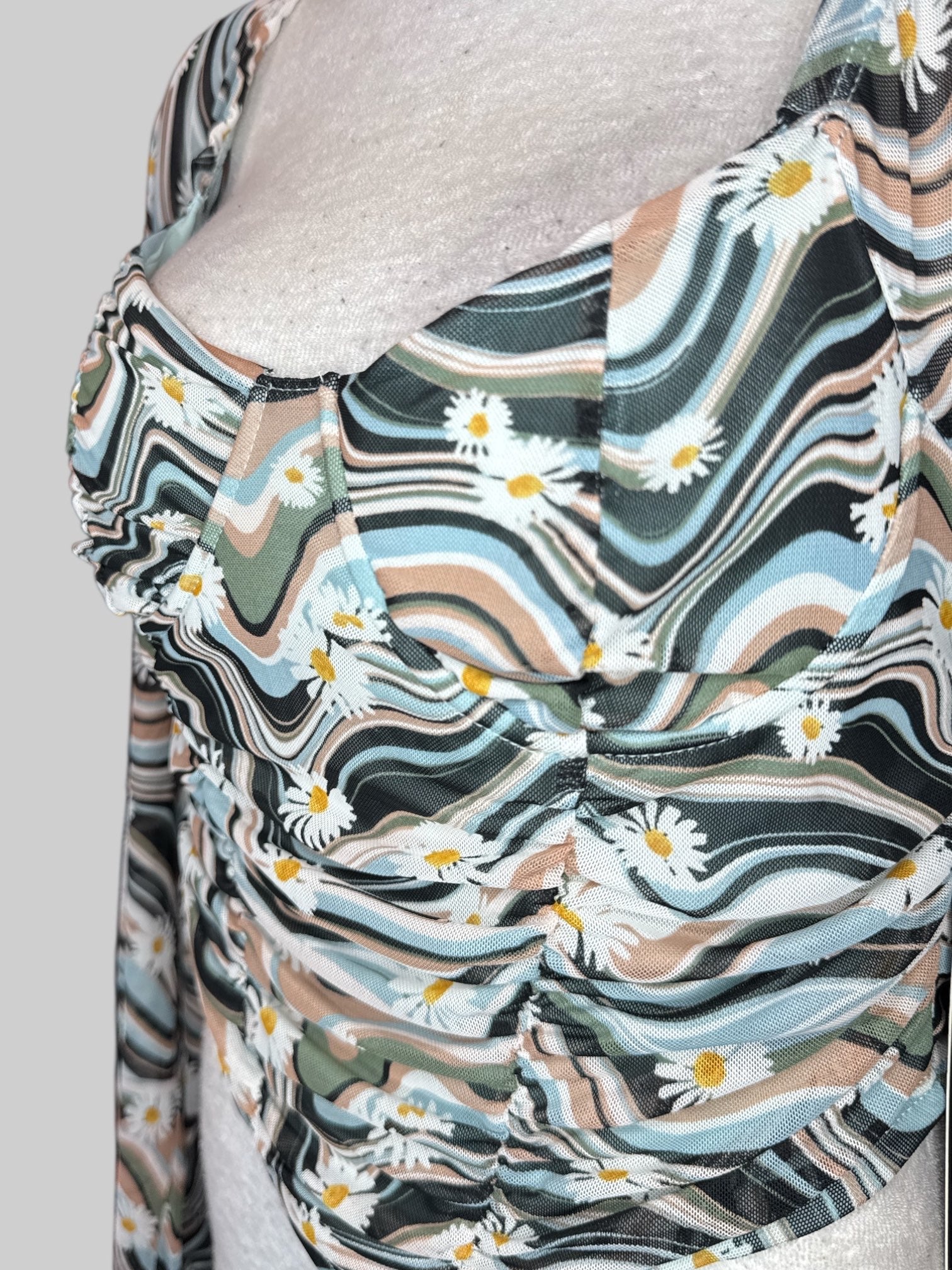 M NWT Multicolor long sleeve top with sheer sleeves, underwire in chest, and ruching  in the front