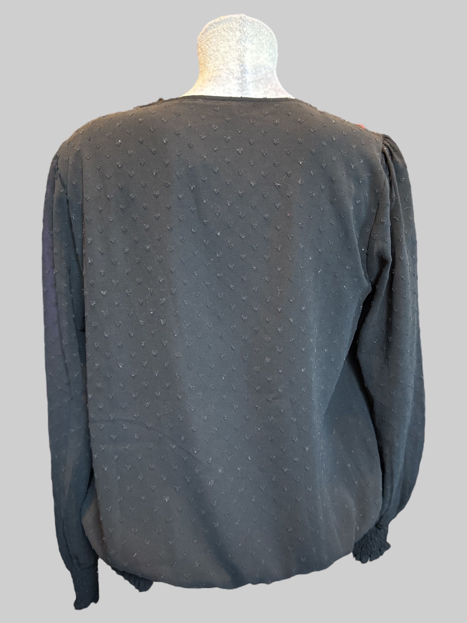 M Black blouse with heart shaped textured polkadots, sheer sleeves, and balloon hem
