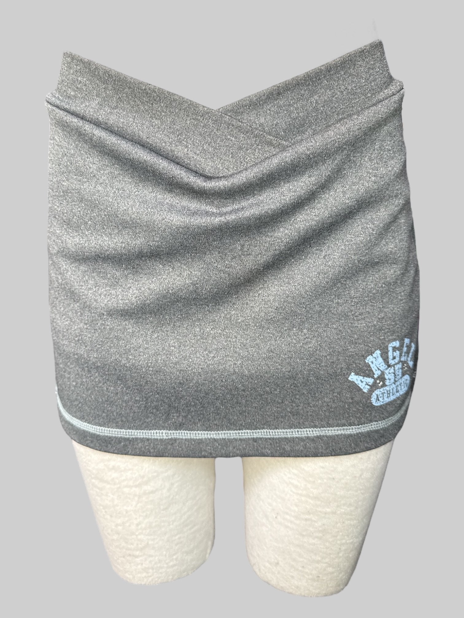 M Heathered grey athletic skort with blue lettering and rhinestones