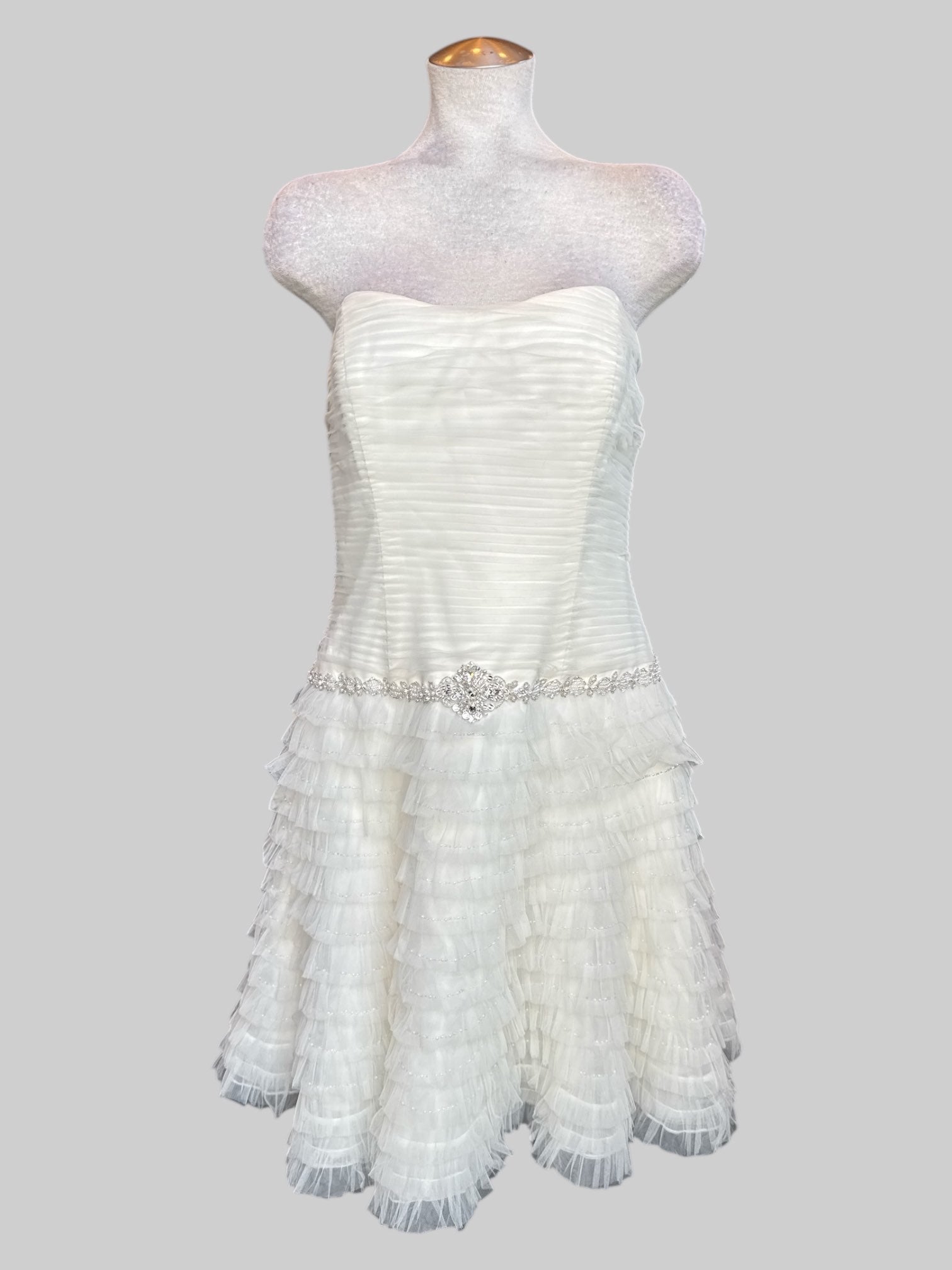 L David’s Bridal white wedding reception type dress with tule ruffles that become sheer at the bottom, pearl and stone belt, boning, and ruched bodice