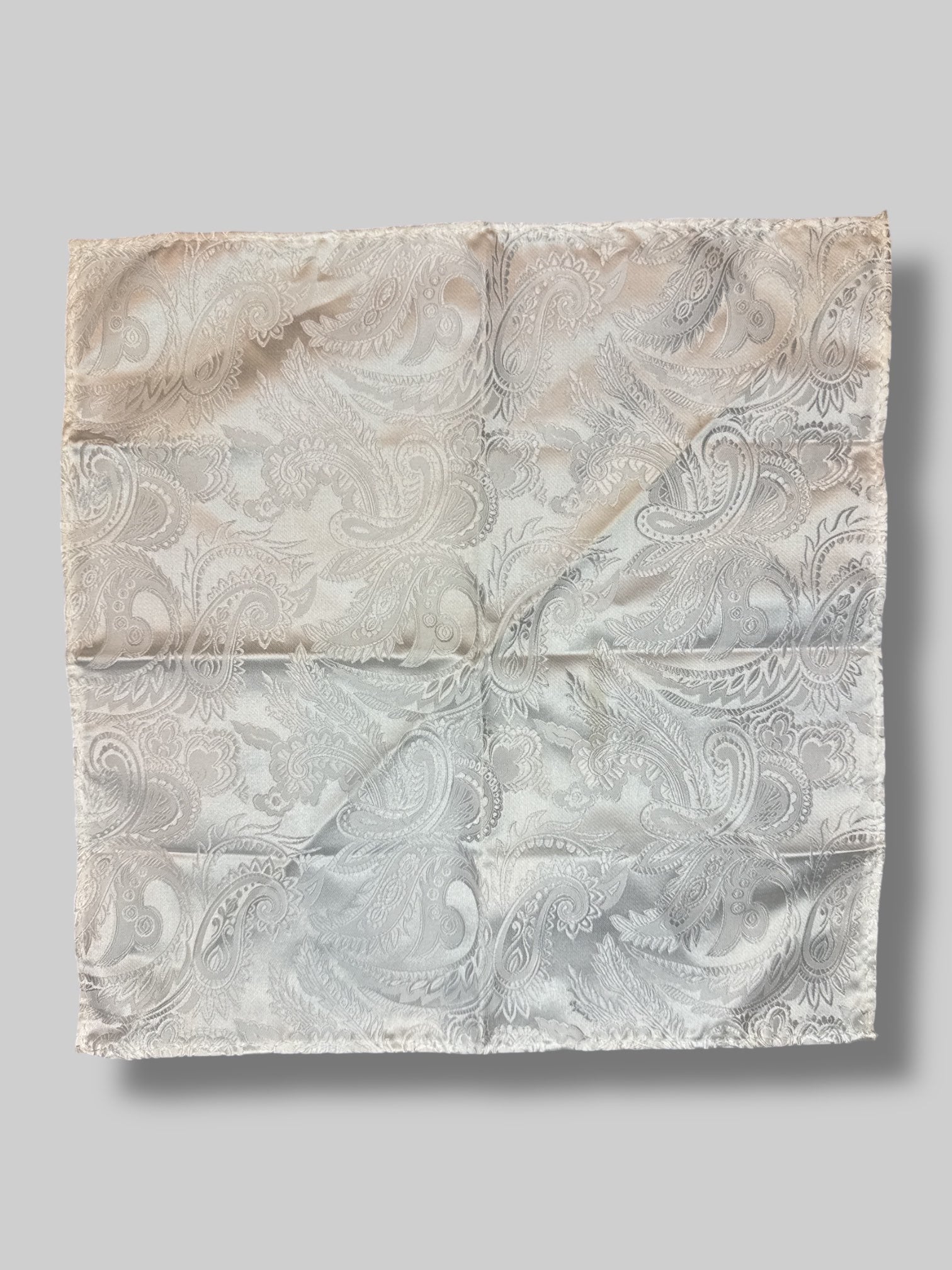 White ornately designed pocket square