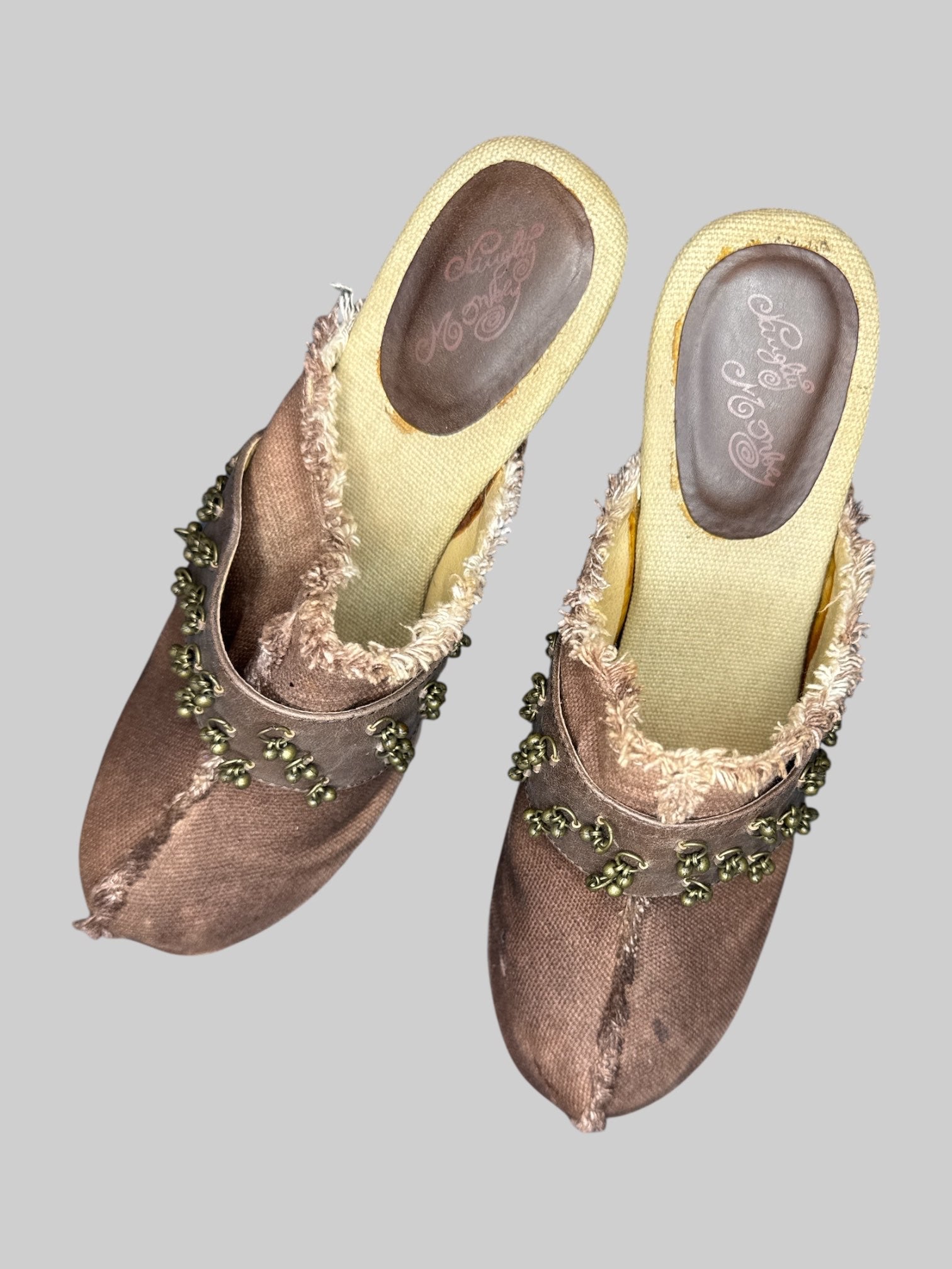 Size 10 brown Naughty Monkey boot heels with charms and front