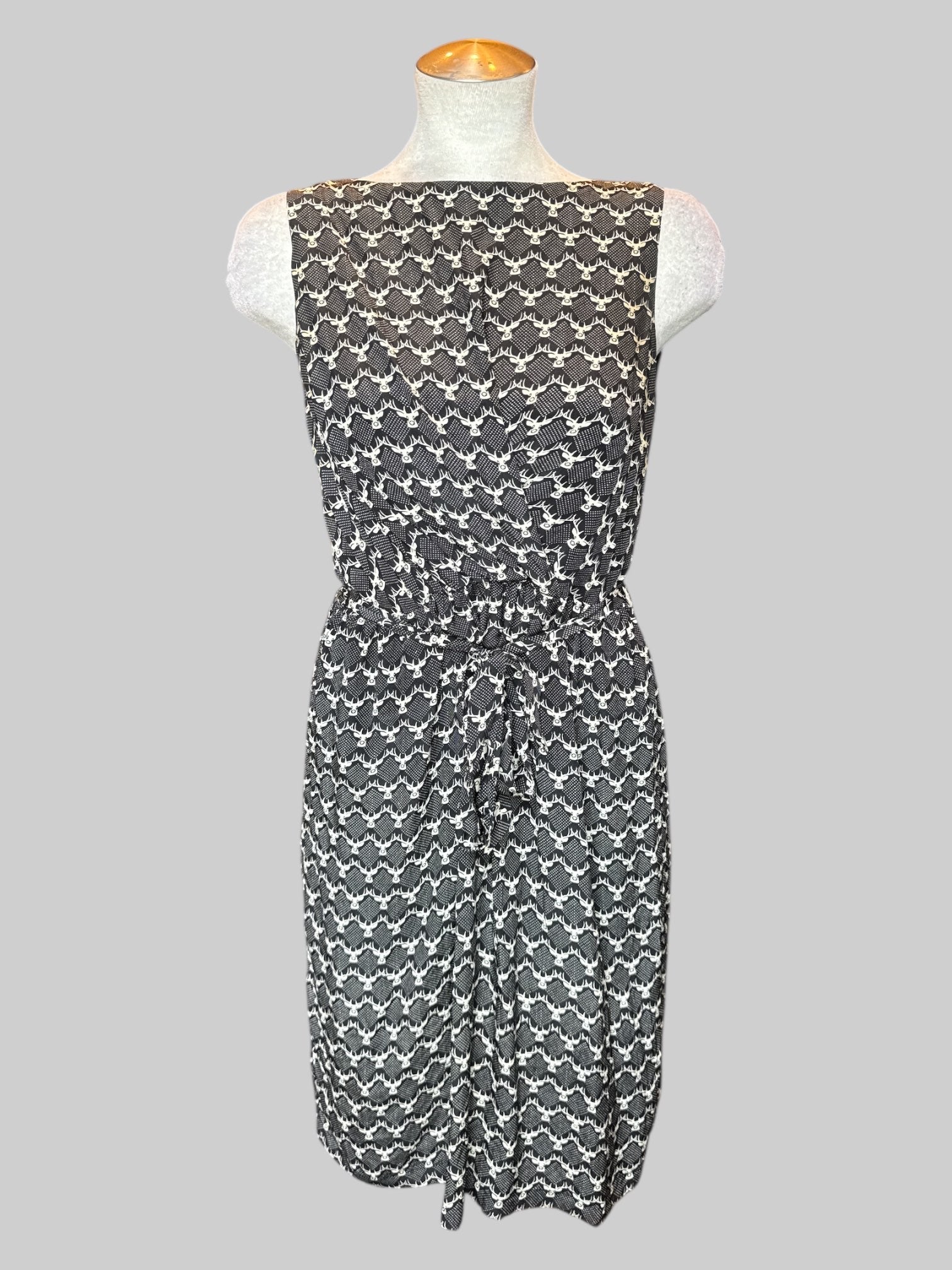 M black dress with white deer pattern and tie