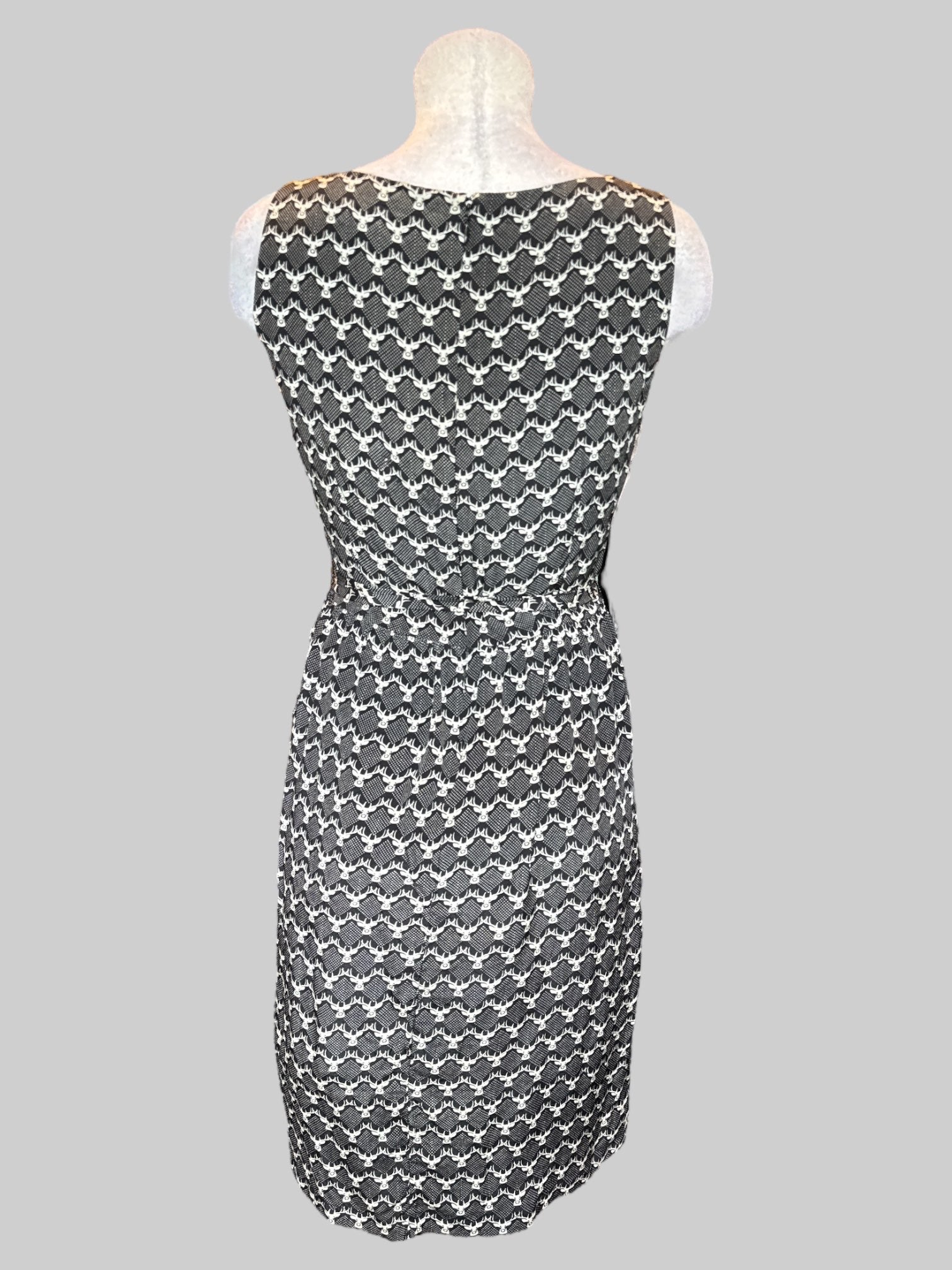 M black dress with white deer pattern and tie