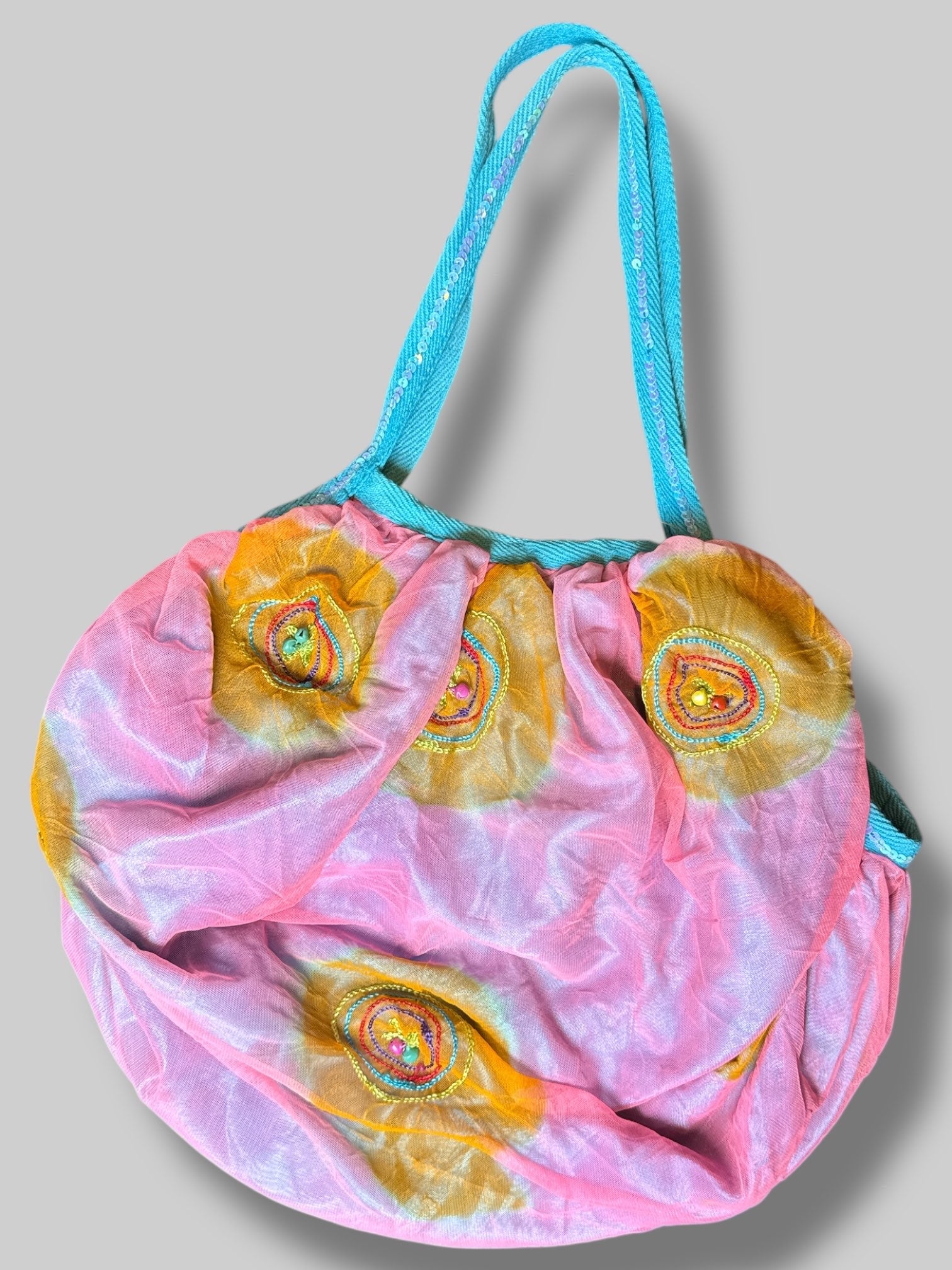 Orange and pink tule bag with beads, sequins, and embroidery
