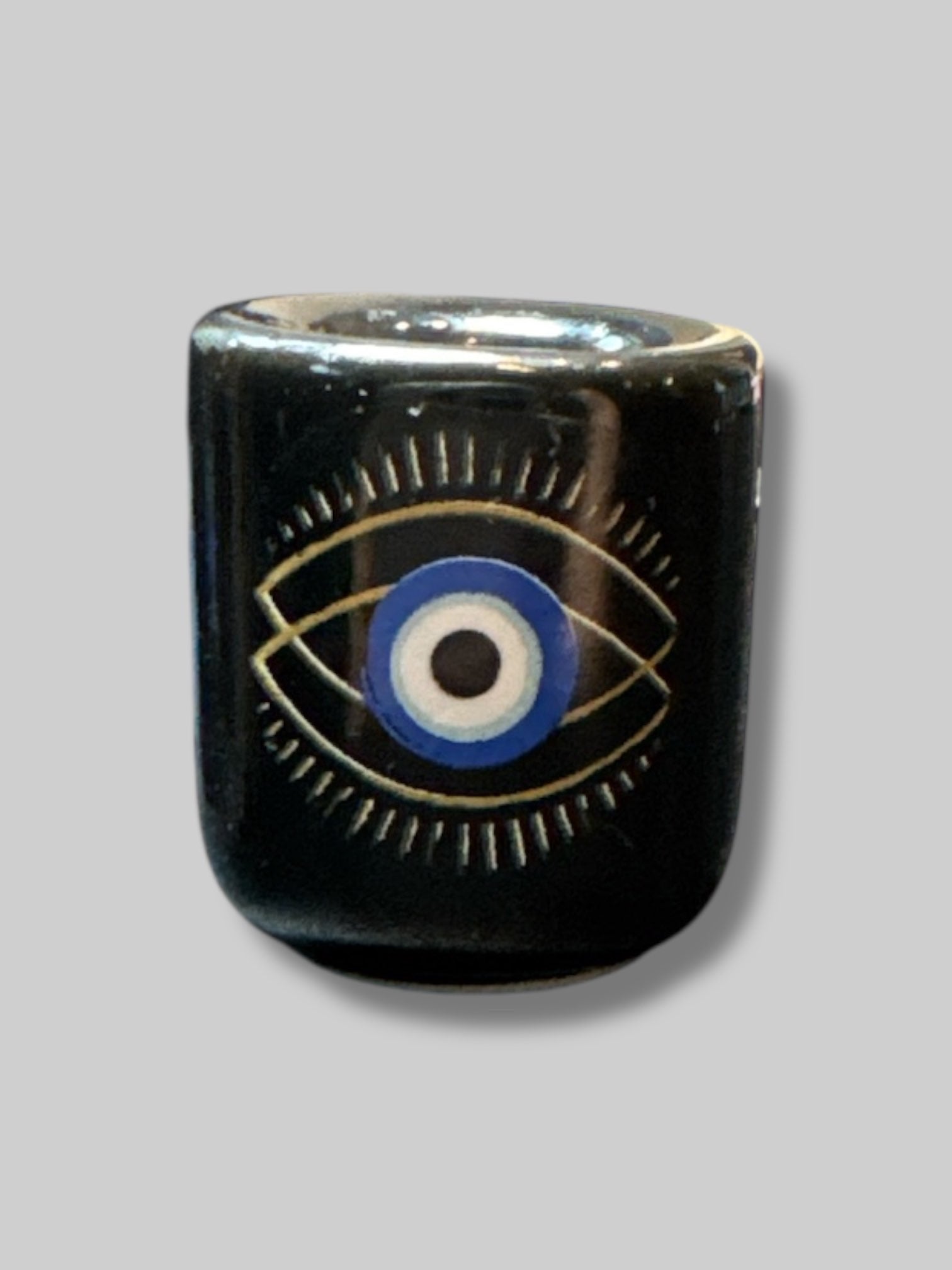 Black candle holder with evil eye