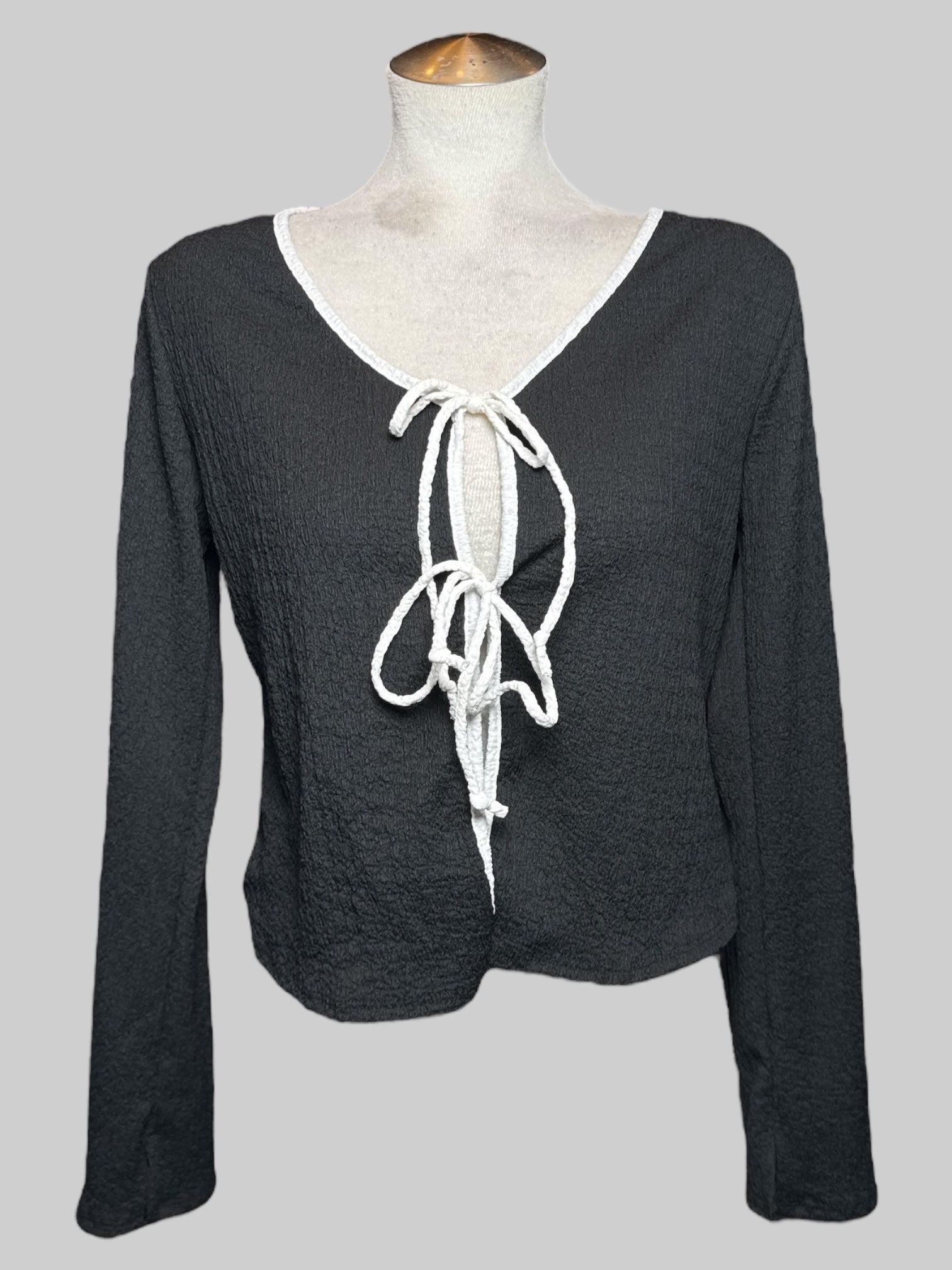 0X black cardigan with double white ties