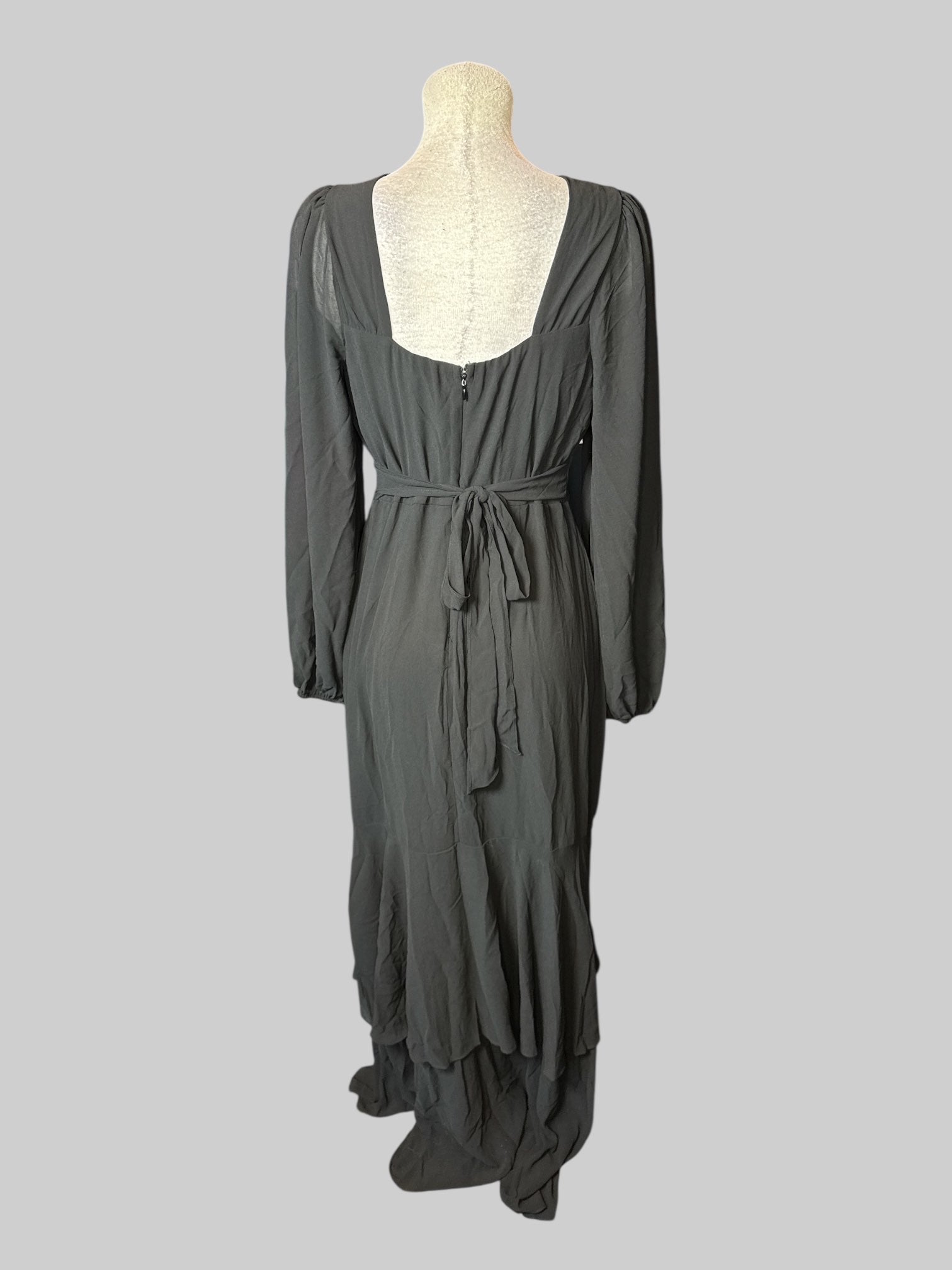 M black long balloon sleeve dress with  flowy bottom, and zipper and tie on back