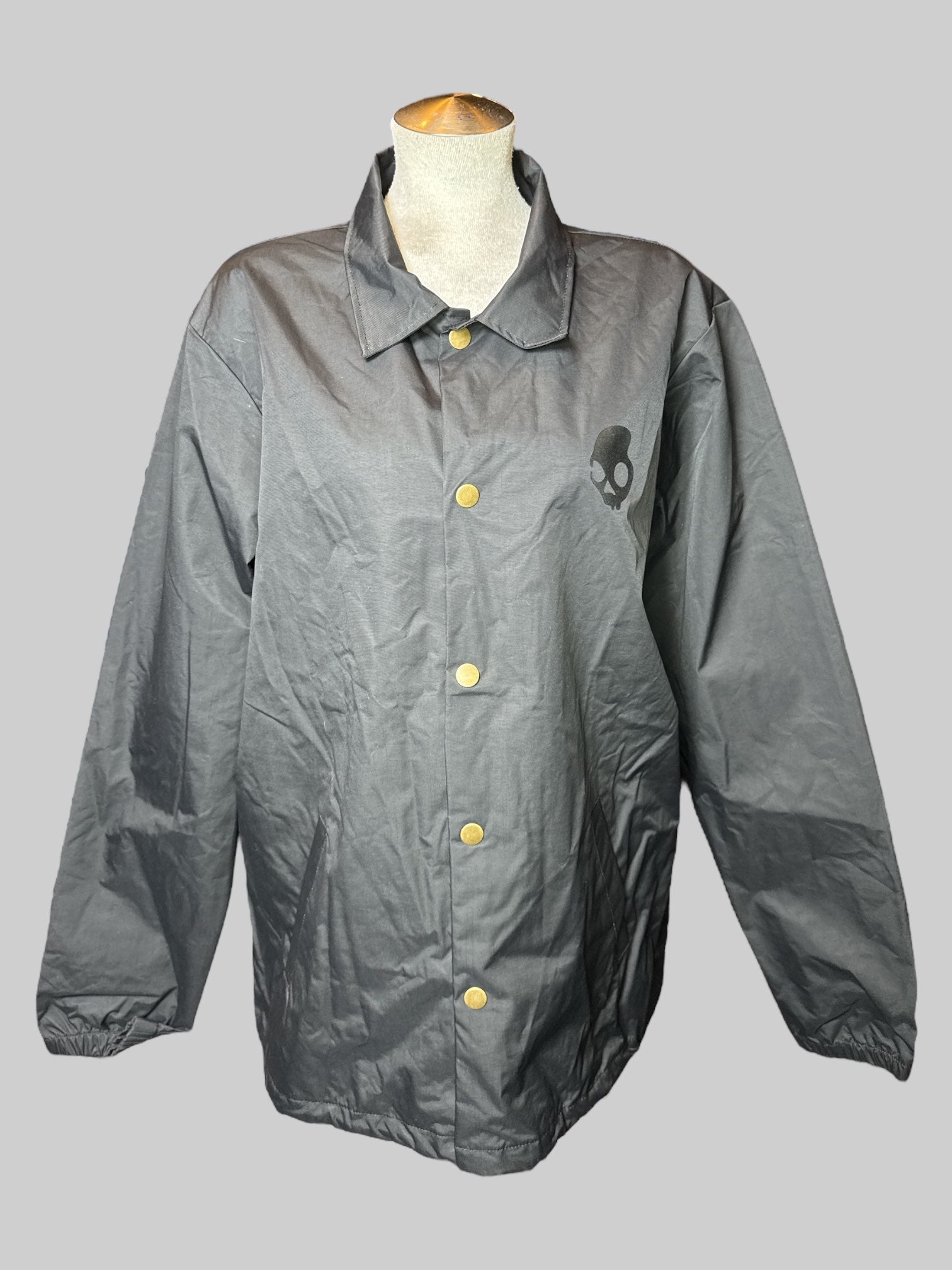 L long sleeve Skull Candy rain jacket with snap buttons pockets and elastic cuffs