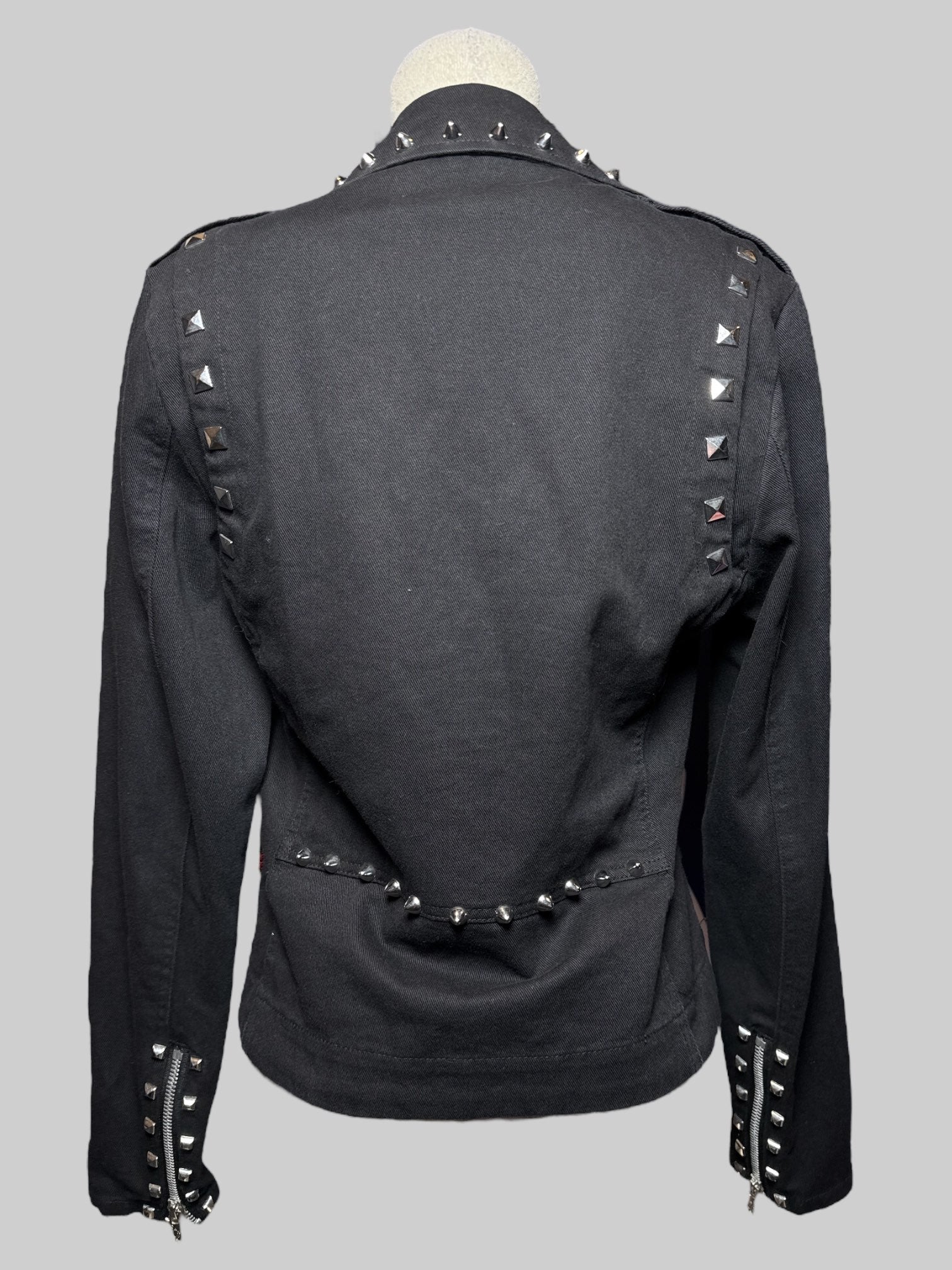 S Tripp black zip up jacket with lots of studs .