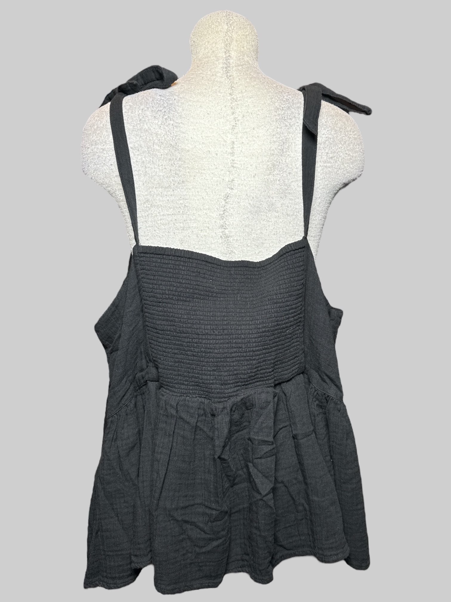 4X black sleeveless top with tie straps, pleating, and shirred back