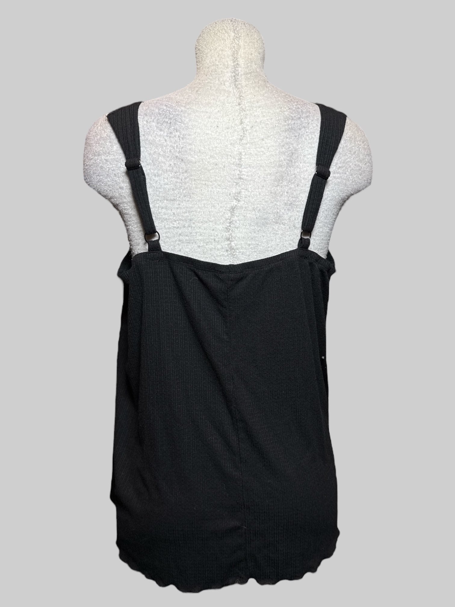2X black sleeveless top with lattice cutouts and lettuce trim