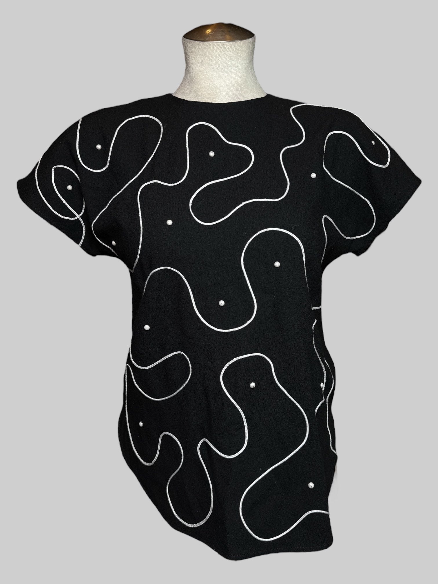S vintage black short sleeve blouse with white embroidery, faux pearls, keyhole back, and slits on the side