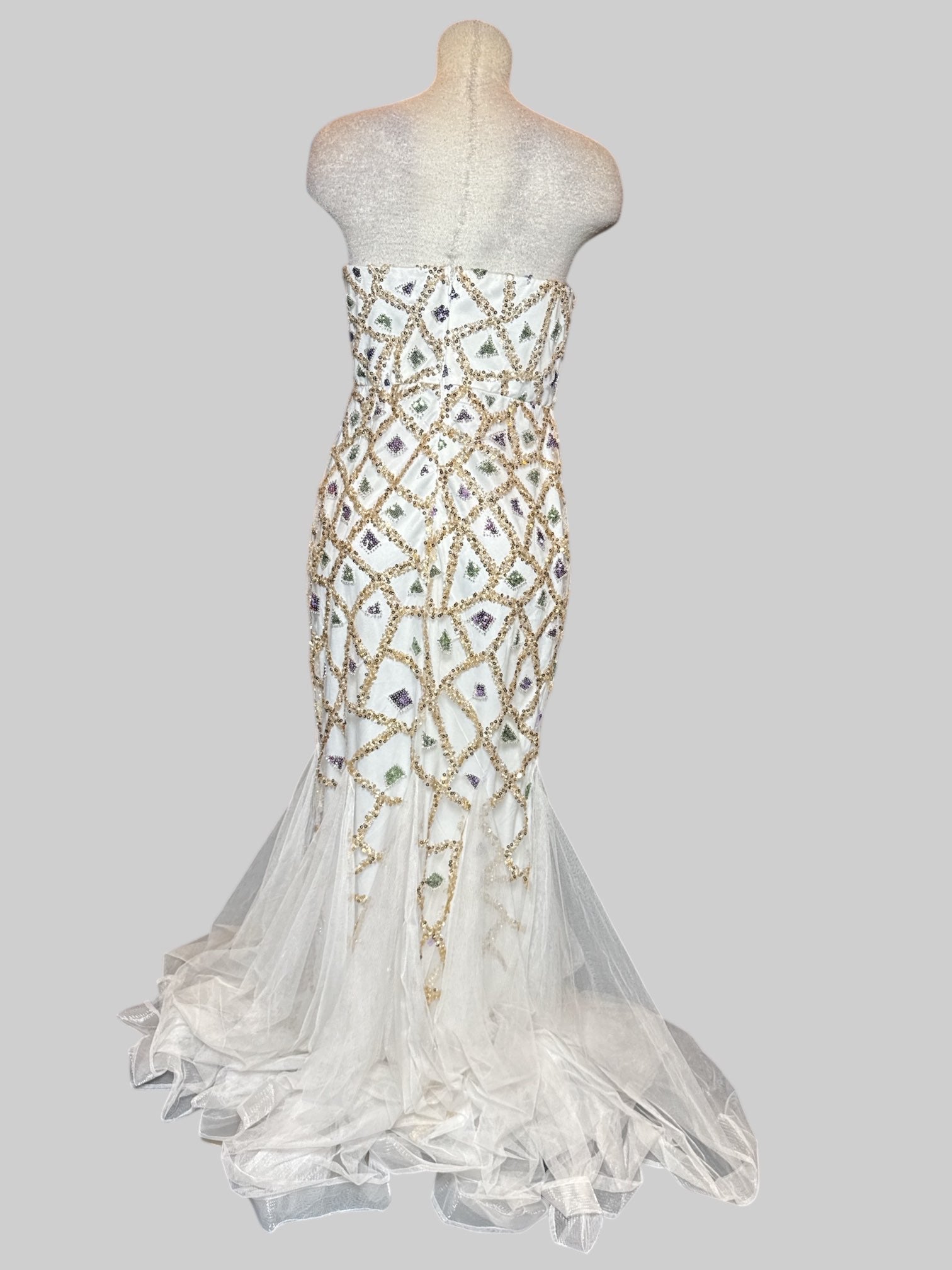 M white formal maxi mermaid style dress with green, purple, and light pink geometric sequin pattern and lots of tule