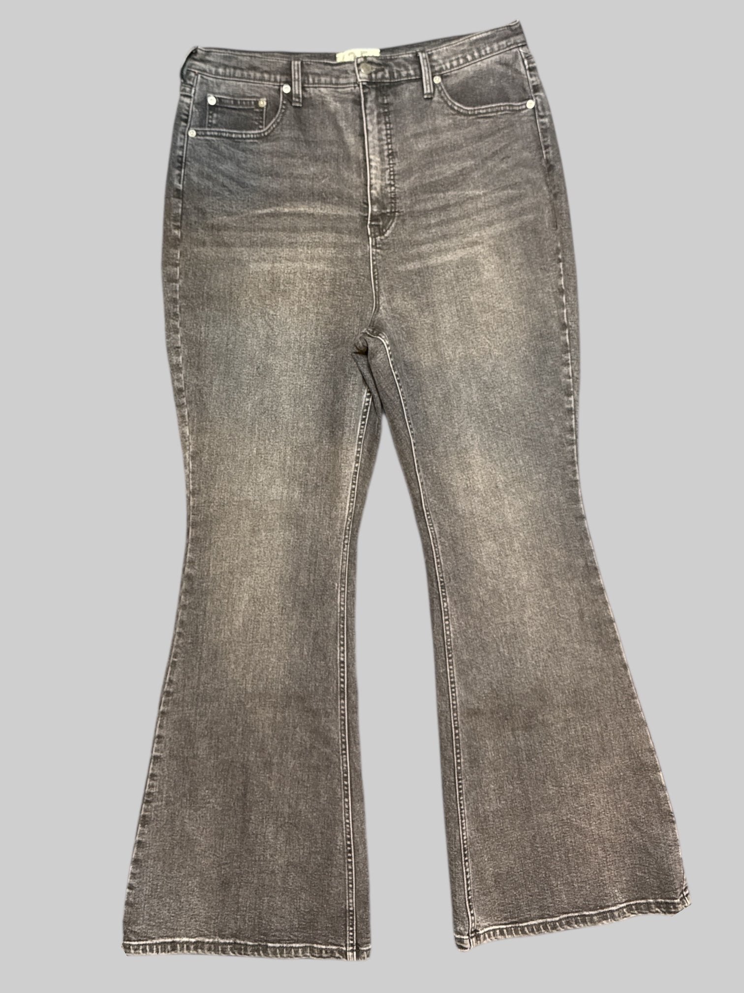 0X NWT Free People black light wash black flare jeans. Small stains on back of pants shown in last photo