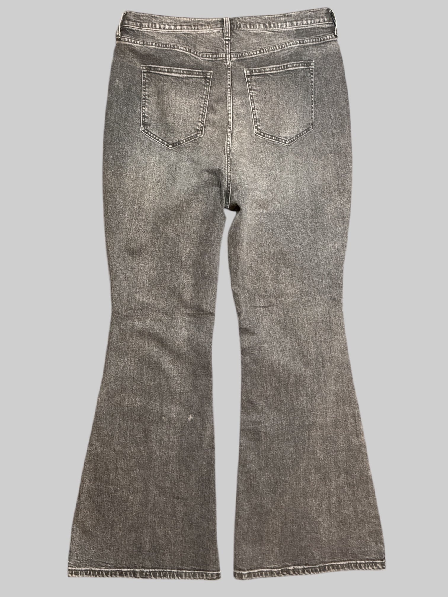 0X NWT Free People black light wash black flare jeans. Small stains on back of pants shown in last photo