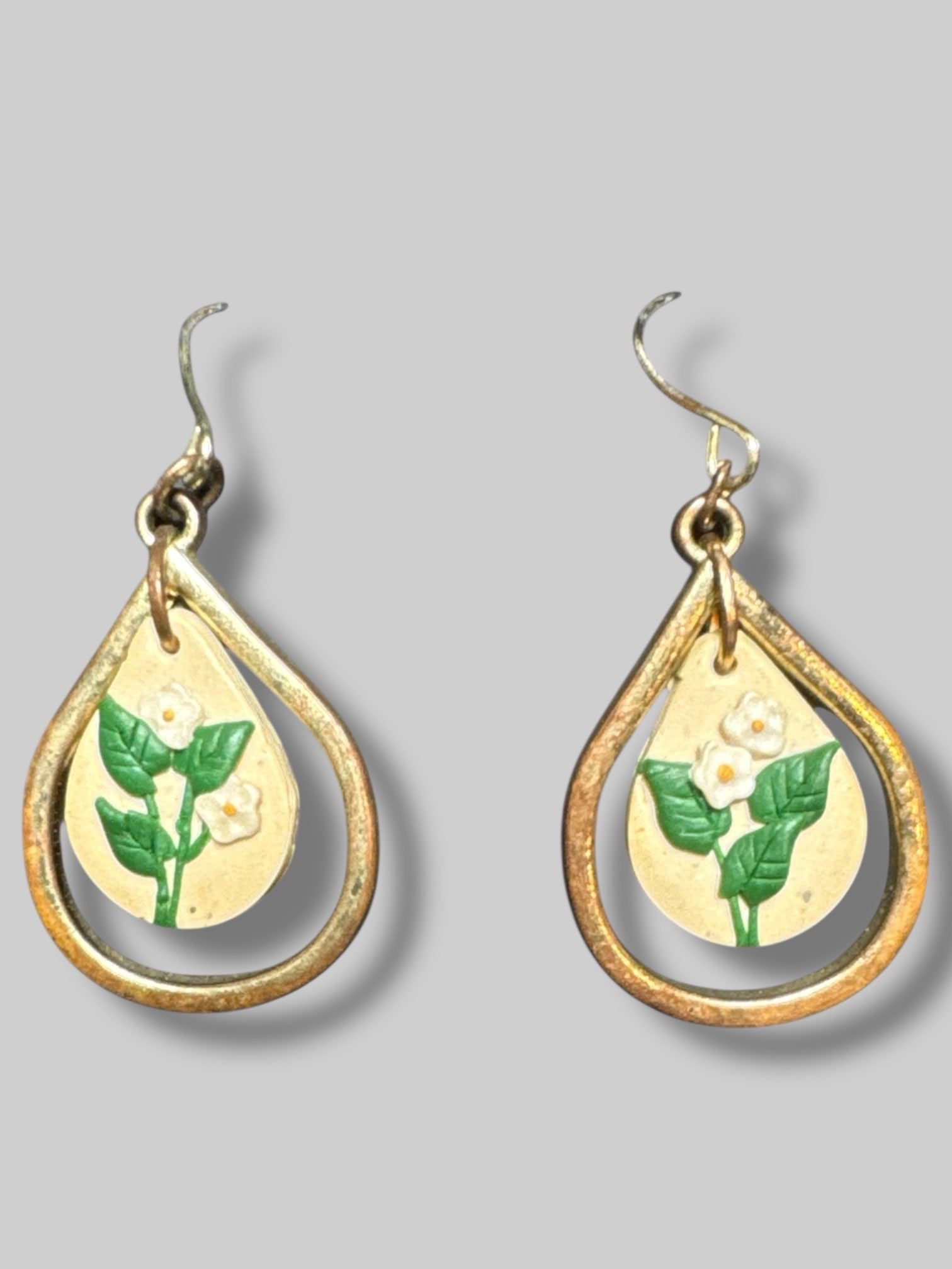 Gold tone earrings with flowers