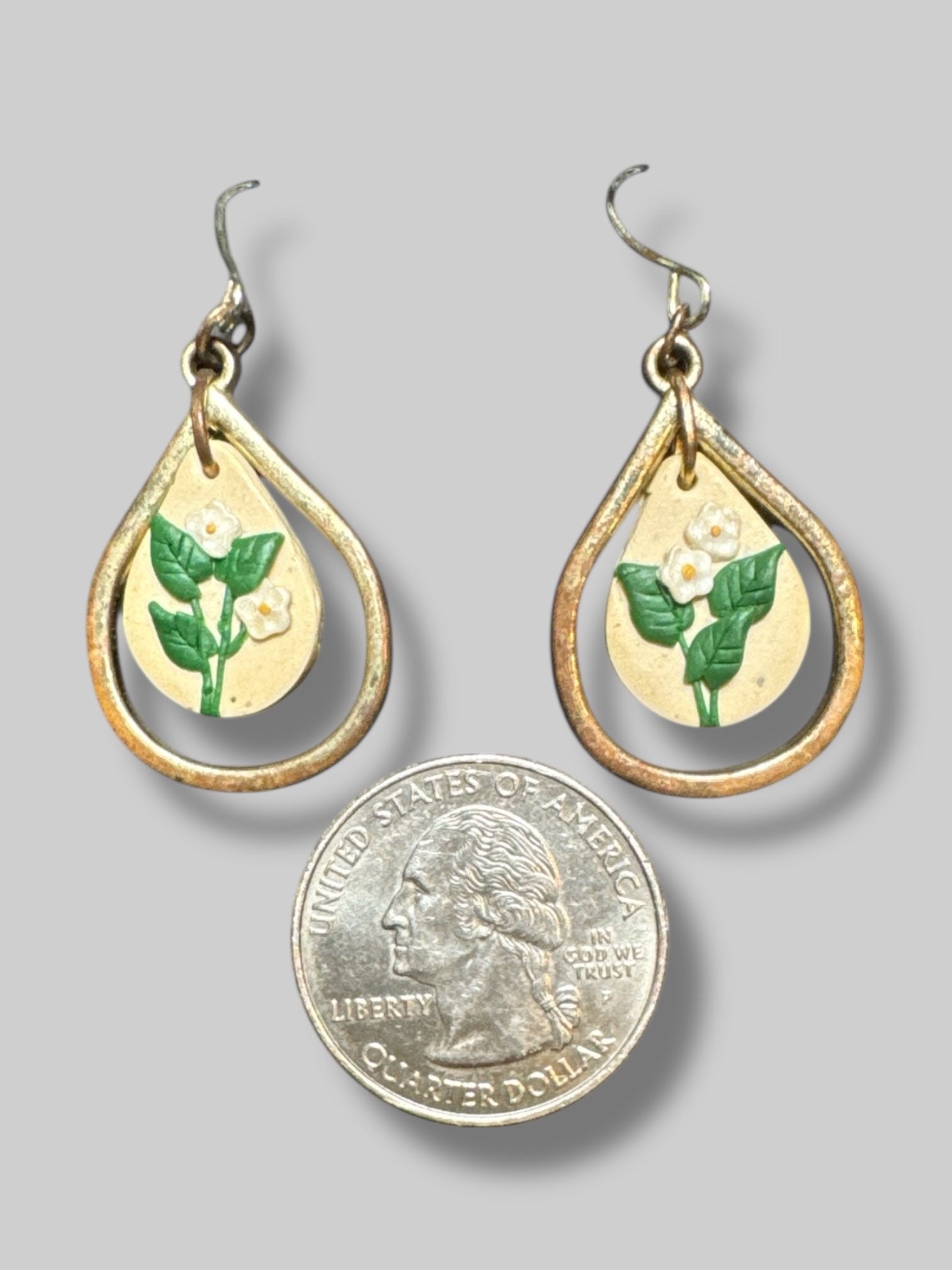 Gold tone earrings with flowers