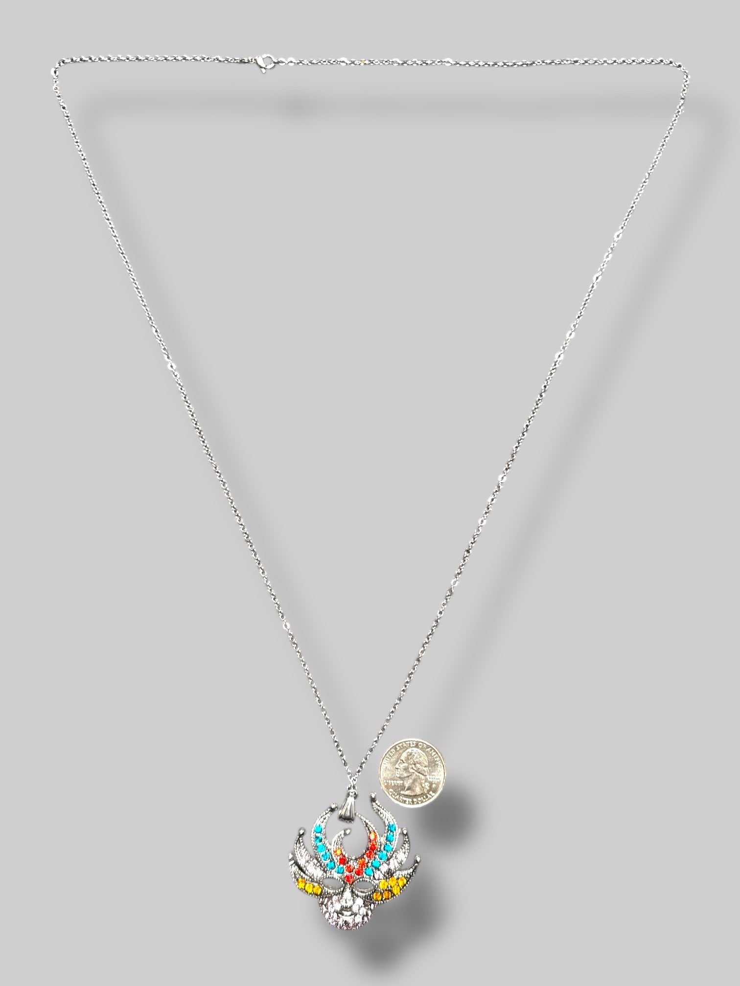 Silver tone multicolor rhinestone mask pendant with 15.5” chain