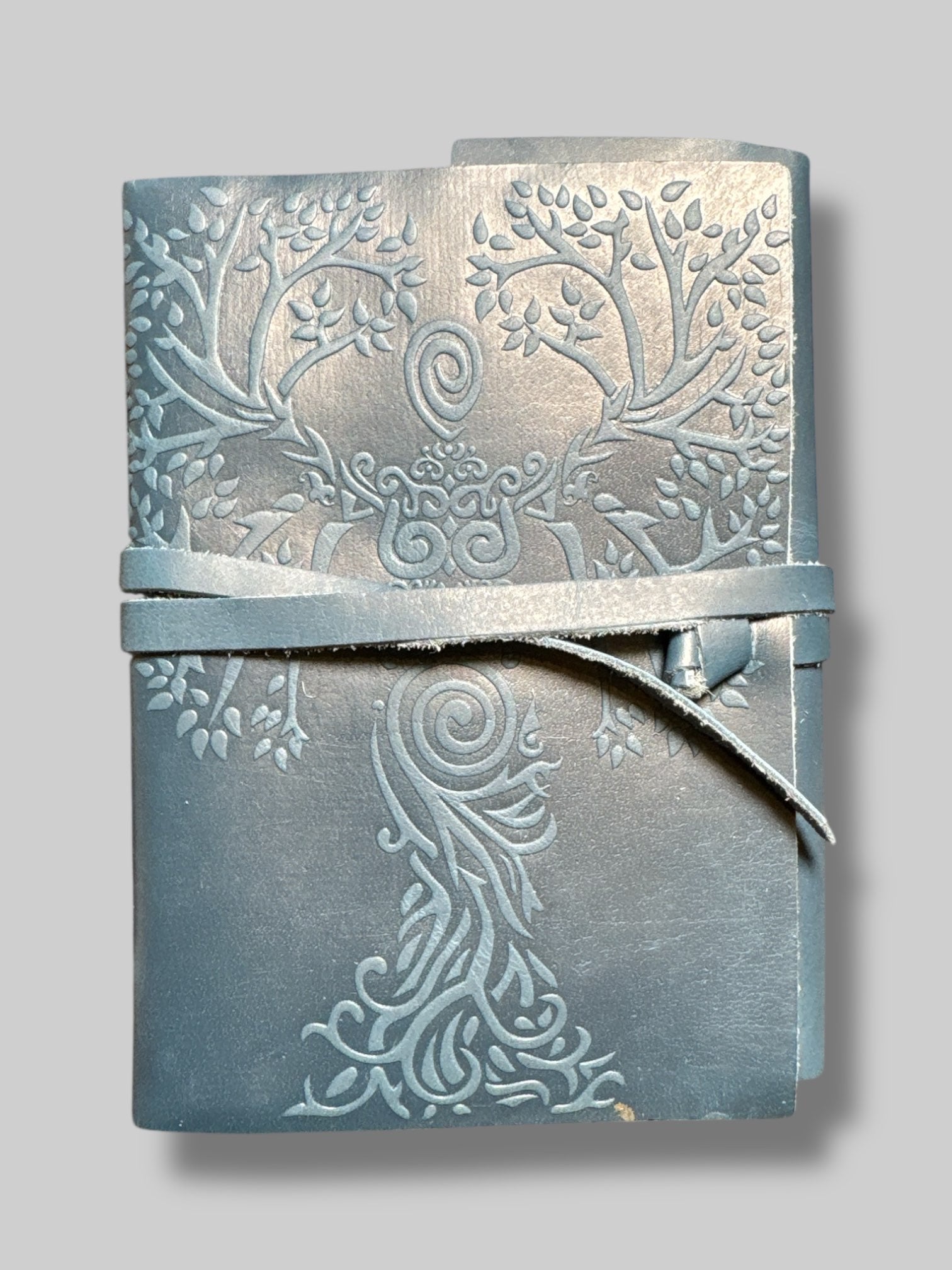 7” by 4.5”  blue leather bound tie journal with owl embossing