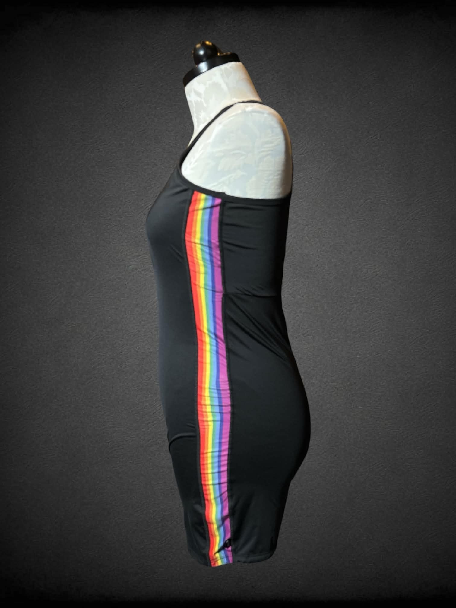 0X Tomboy X black body suit with rainbow lining on each side, and cutout on back