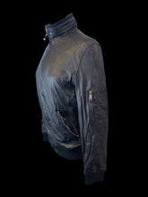 Load image into Gallery viewer, L Black leather zip-up jacket w/ blue, white, &amp; red cotton lining, zipper details, &amp; rib knit hems
