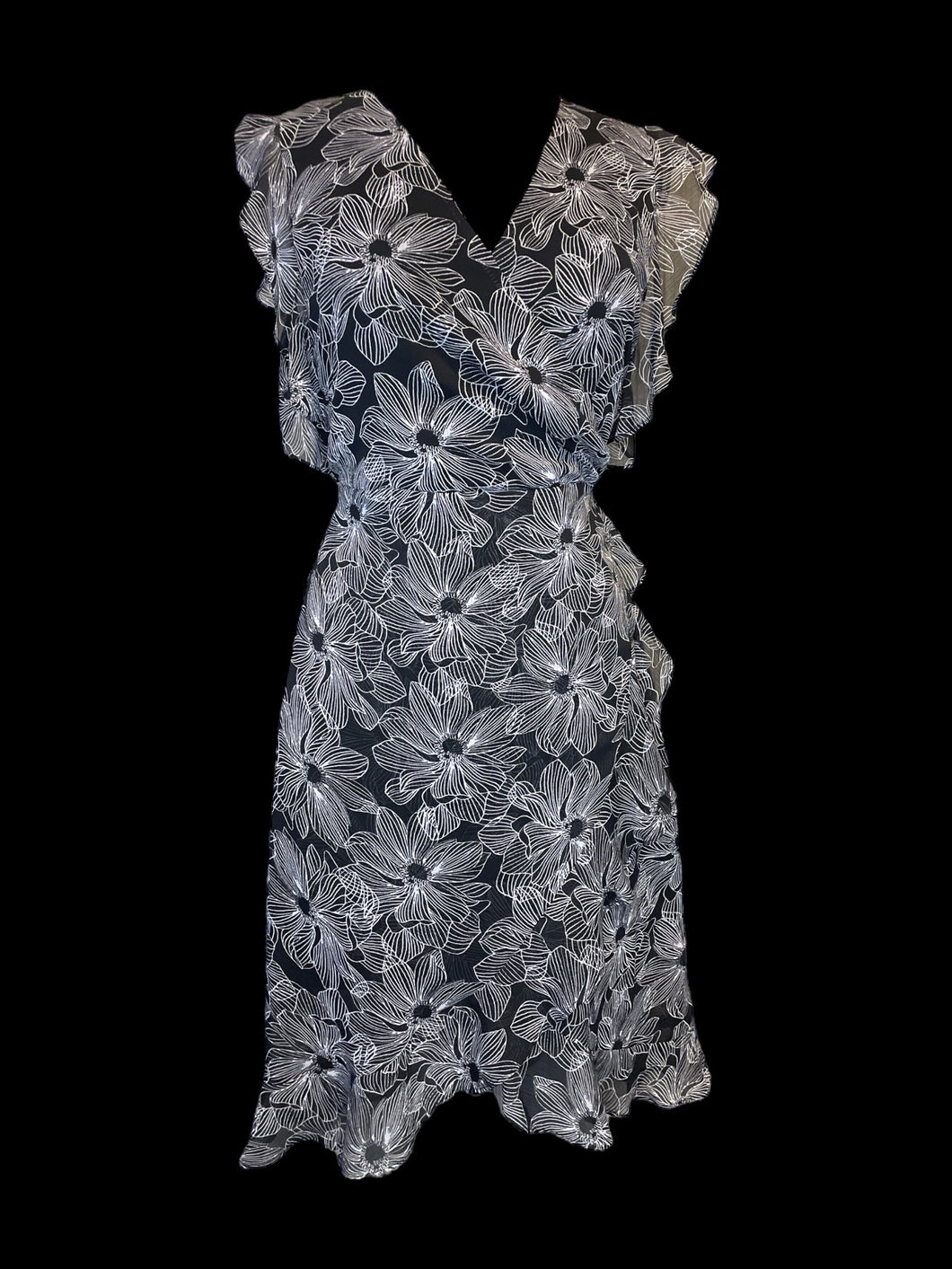 L Black sleeveless mock wrap dress w/ sheer white floral pattern skirt, back tie, & ruffle details
