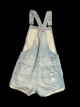Load image into Gallery viewer, S Light blue distressed denim overall shorts w/ adjustable straps, pockets, belt loops, cuffed hems, &amp; side button closures
