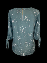 Load image into Gallery viewer, L Teal, white, &amp; black leaf pattern 1/2 balloon sleeve round neckline top w/ zipper closure
