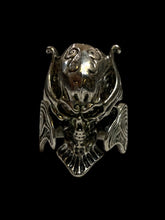 Load image into Gallery viewer, 13.5 Silver-like skull helm profile ring w/ swirl details
