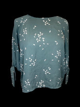 Load image into Gallery viewer, L Teal, white, &amp; black leaf pattern 1/2 balloon sleeve round neckline top w/ zipper closure
