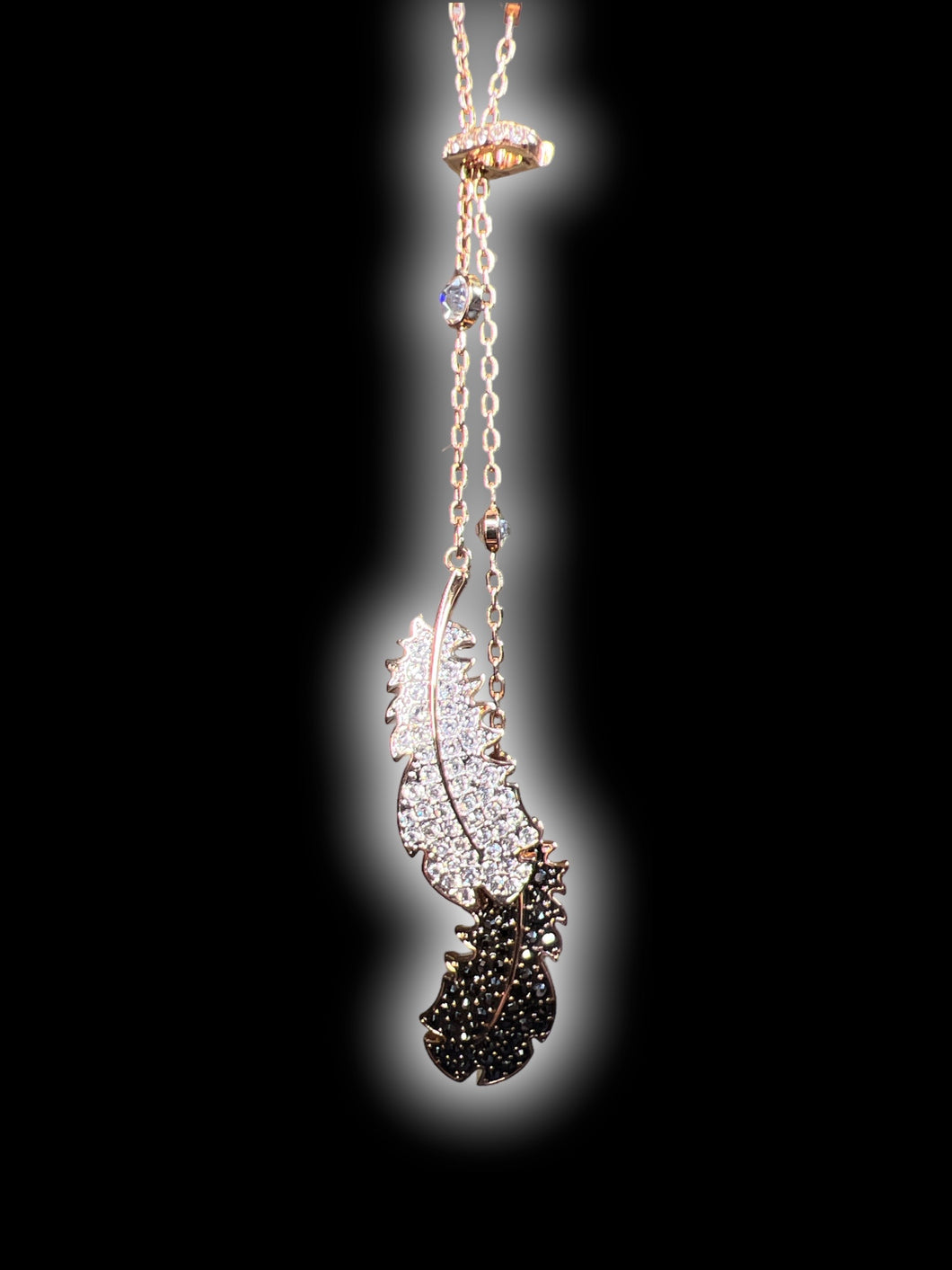 Swarovski’s “Naughty Chandelier” rose gold-like wrap necklace w/ clear & black gem wings