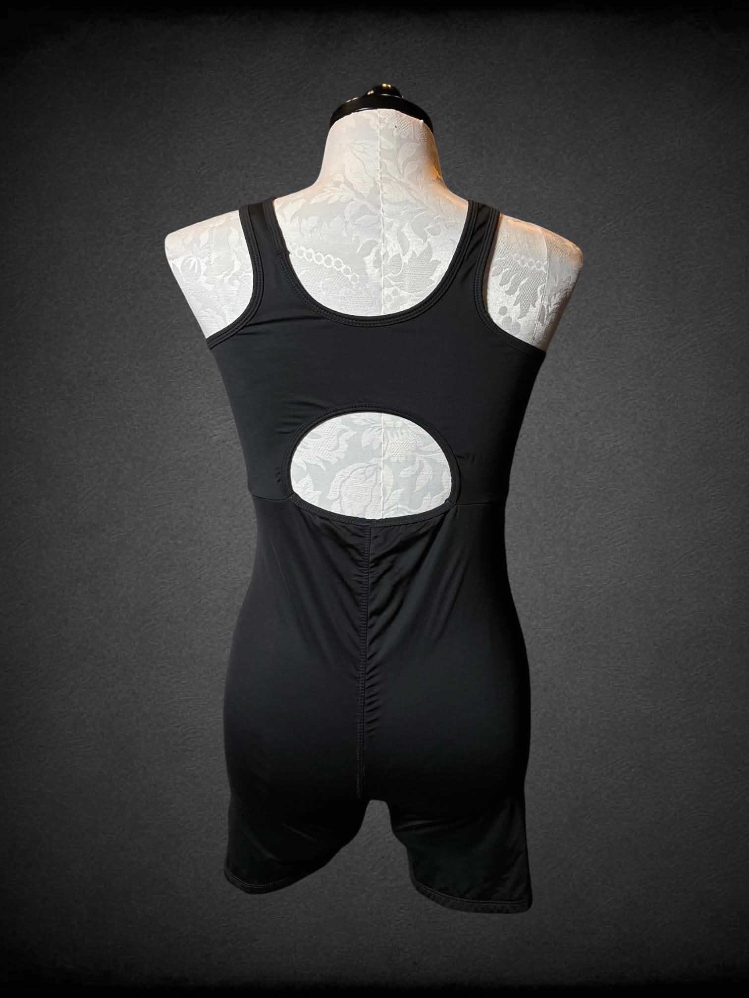 0X Tomboy X black body suit with rainbow lining on each side, and cutout on back