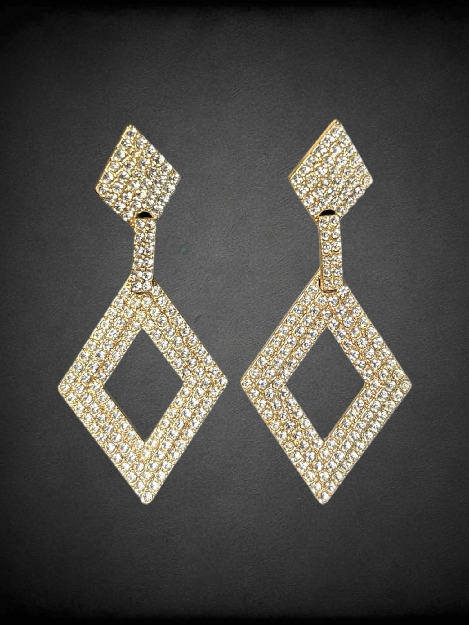 Gold toned diamond shape large dangle earrings with silver rhinestones