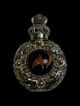 Load image into Gallery viewer, Silver-like &amp; yellow ornate setting round perfume bottle w/ black &amp; metallic gold round stone
