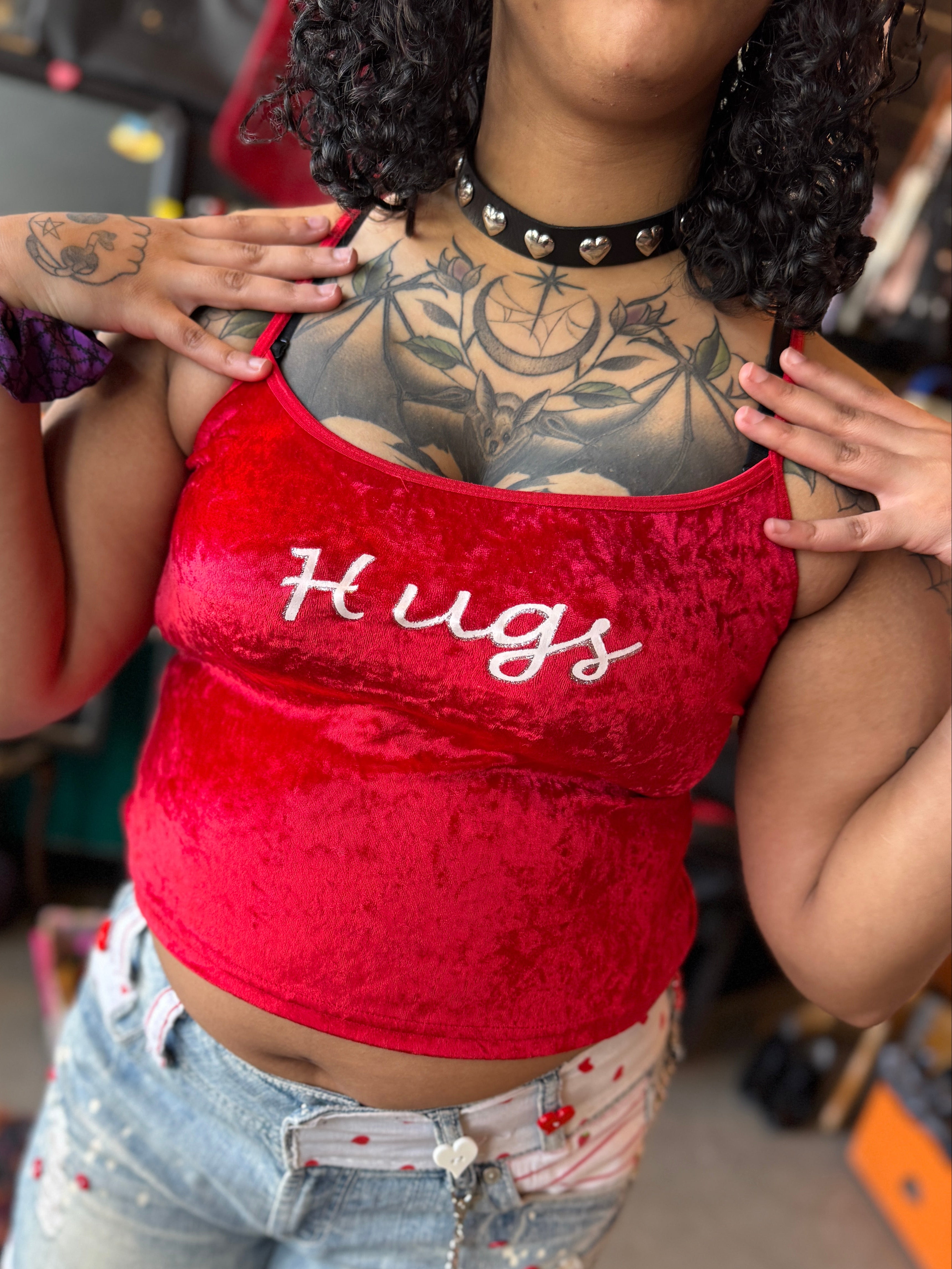 L Tender Secrets red crushed velvet tank top with white and silver glitter “Hugs”