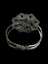 Load image into Gallery viewer, Silver-like hinge closure cuff bracelet w/ multiple clear cut gem floral setting
