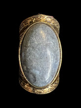 Load image into Gallery viewer, 5 Brass-like ring w/ blue grey oval stone, &amp; ornate setting
