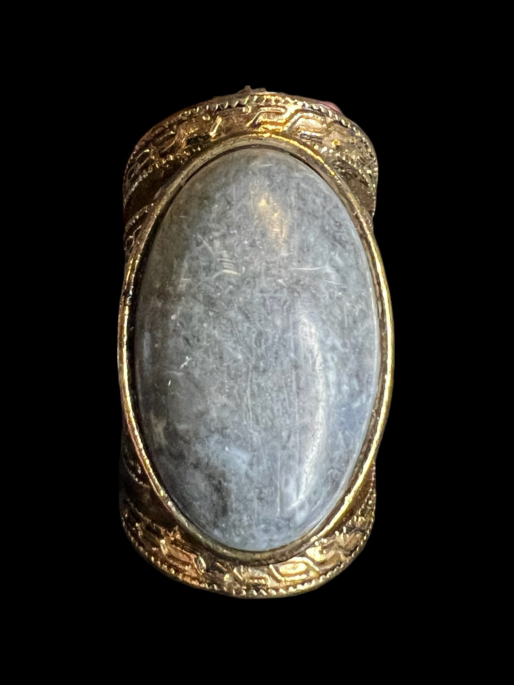 5 Brass-like ring w/ blue grey oval stone, & ornate setting