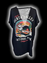 Load image into Gallery viewer, 2X Black short sleeve scoop neck top w/ “Visit Death Valley National Park California” skeleton on a law chair graphic, distressed front, &amp; folded cuffs
