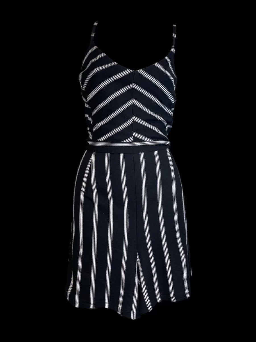 0x Black sleevless sweetheart neckline romper w/ stylized white stripes, lace back, open back, & back zipper closure