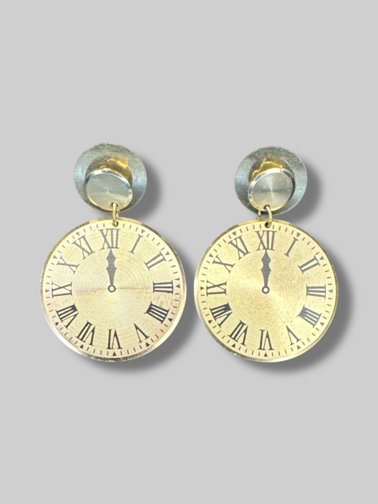 Brass tone clock face earrings with Roman numerals