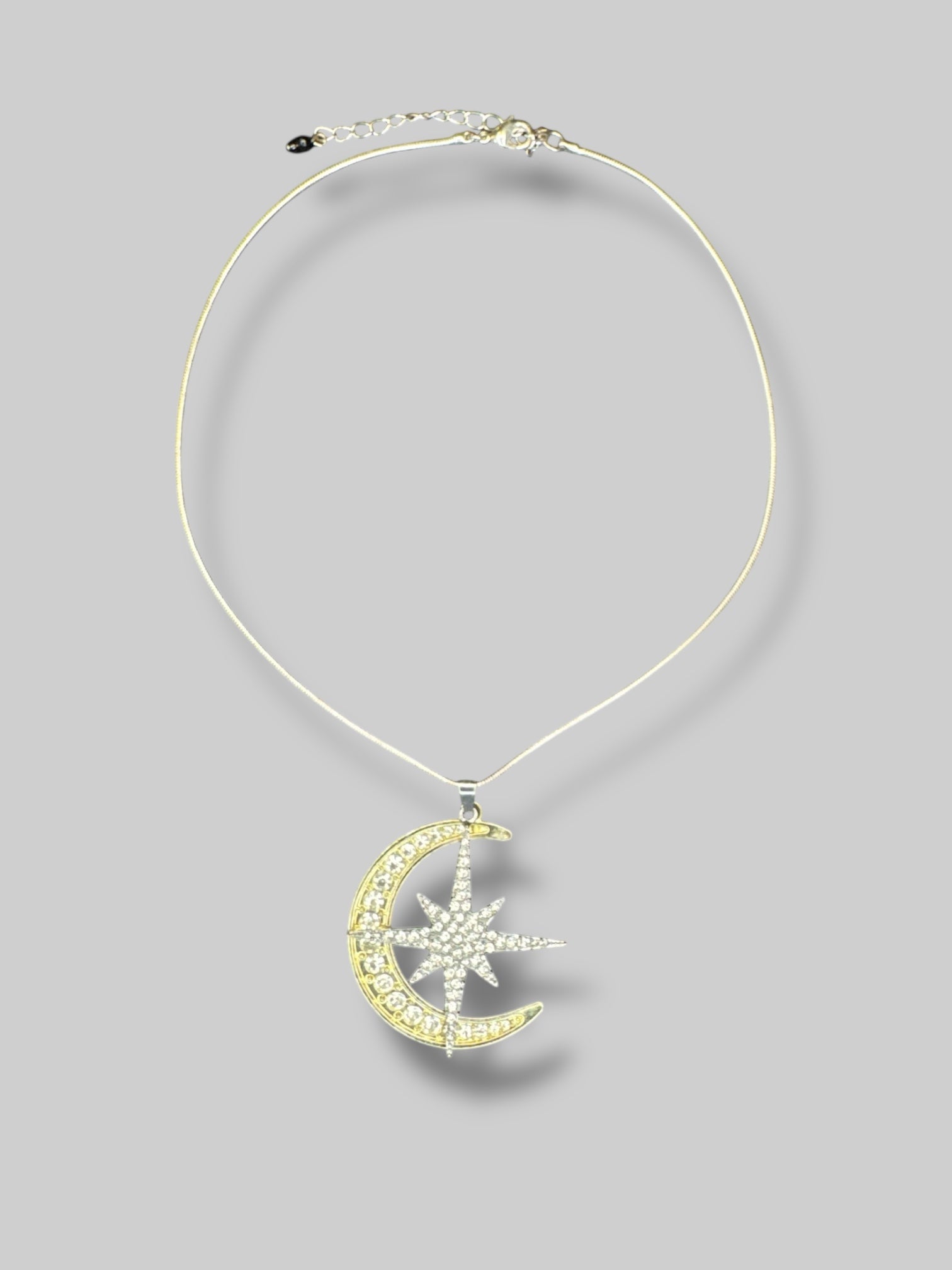 Adjustable necklace with gold moon and silver star rhinestoned pendants