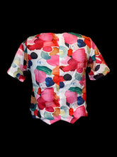 Load image into Gallery viewer, M White &amp; multicolor abstract pattern short sleeve scoop neck top w/ chevron hem, textured fabric, &amp; zipper closure
