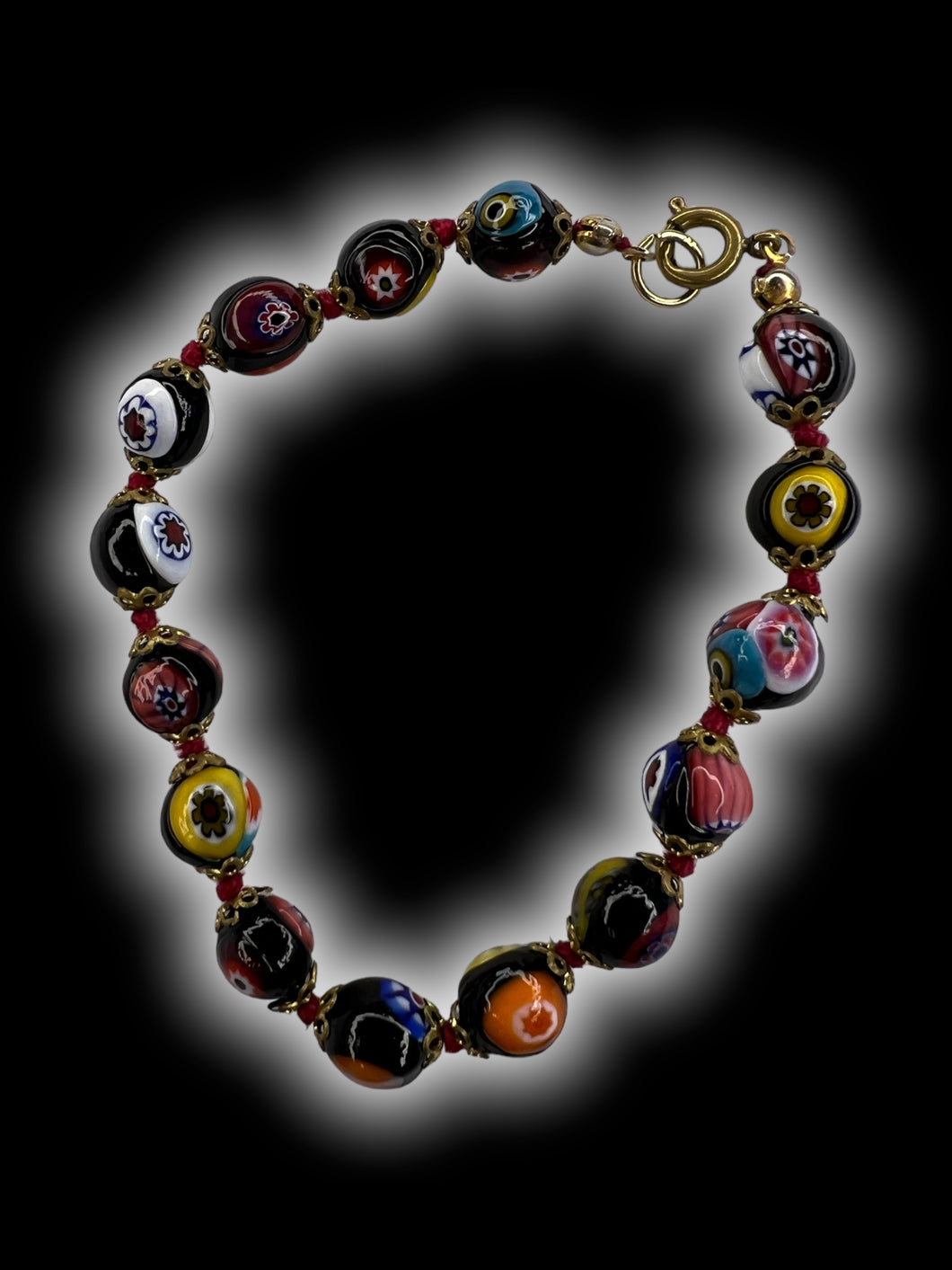 Black & multicolor round beaded bracelet w brass-like sprint ring clasp