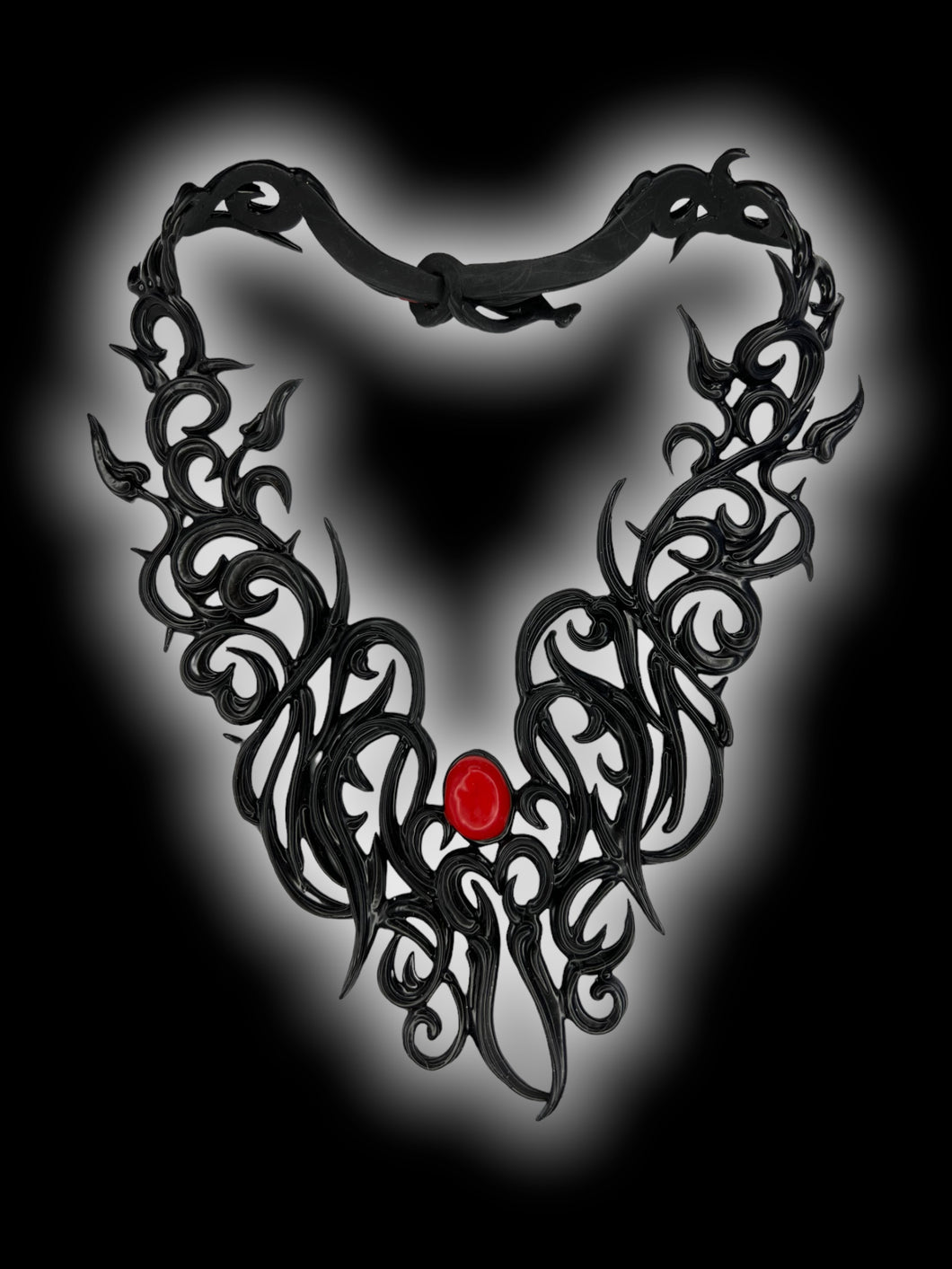 Black latex ornate pattern red stone necklace w/ arrow clasp, box, & care instructions